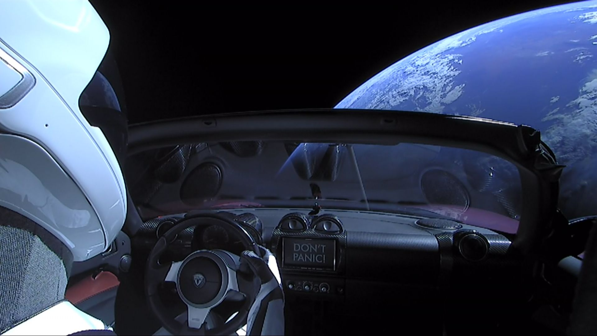 A Tesla roadster launched from the Falcon Heavy rocket with a dummy driver named 'Starman'.