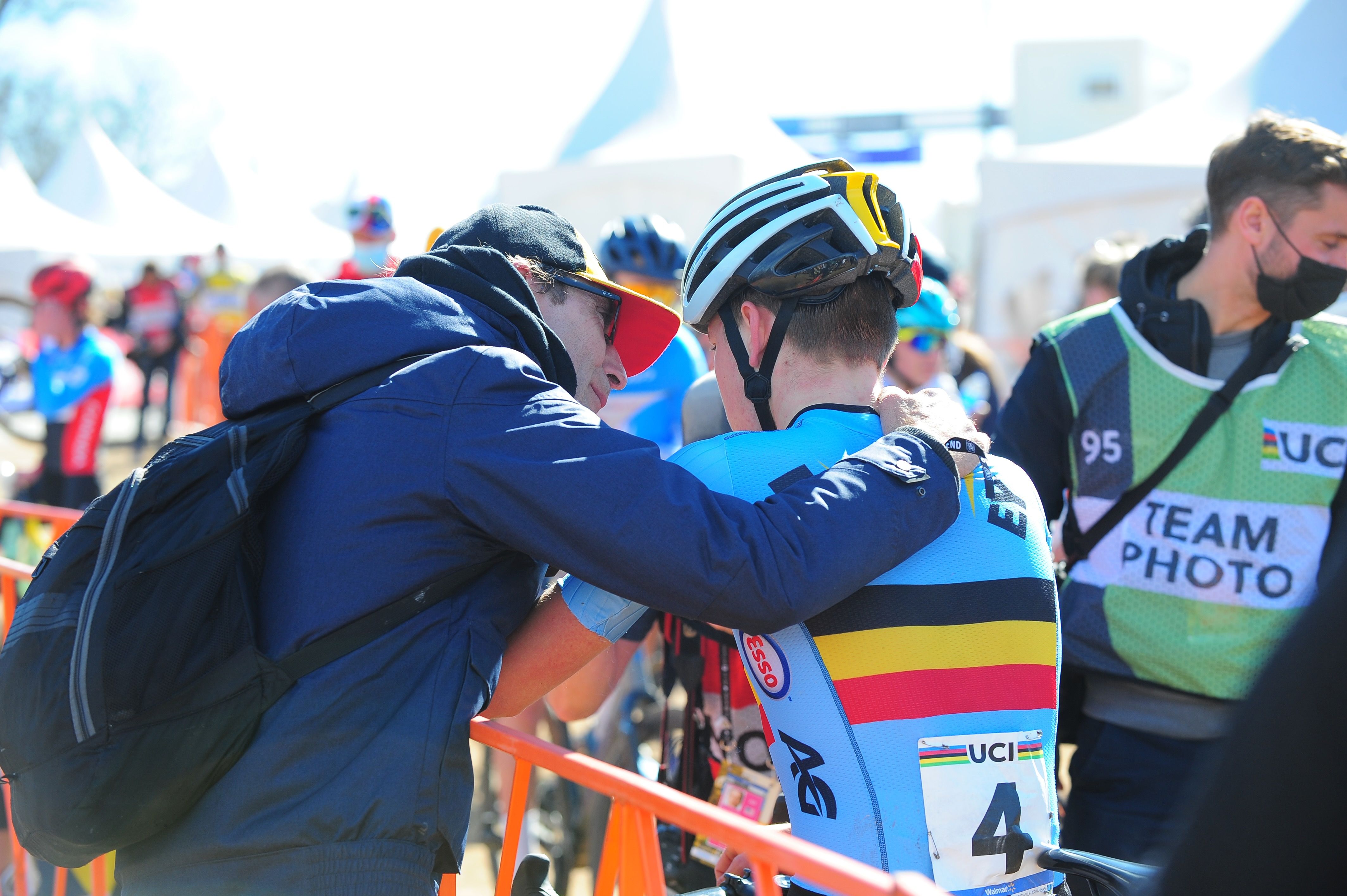 A junior men's Belgium team member is consoled after his race. 