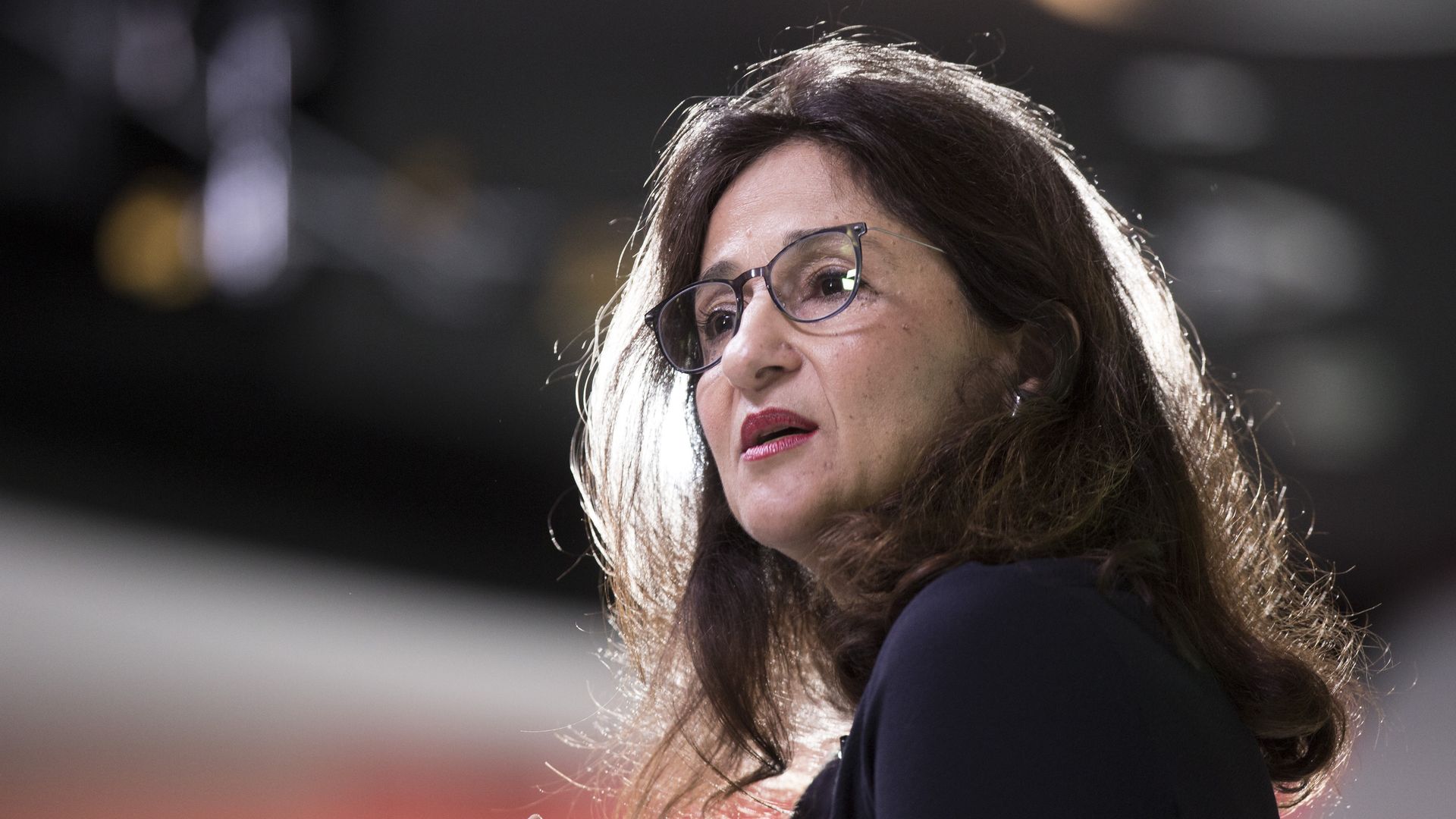 Photo of Nemat Shafik speaking on a stage