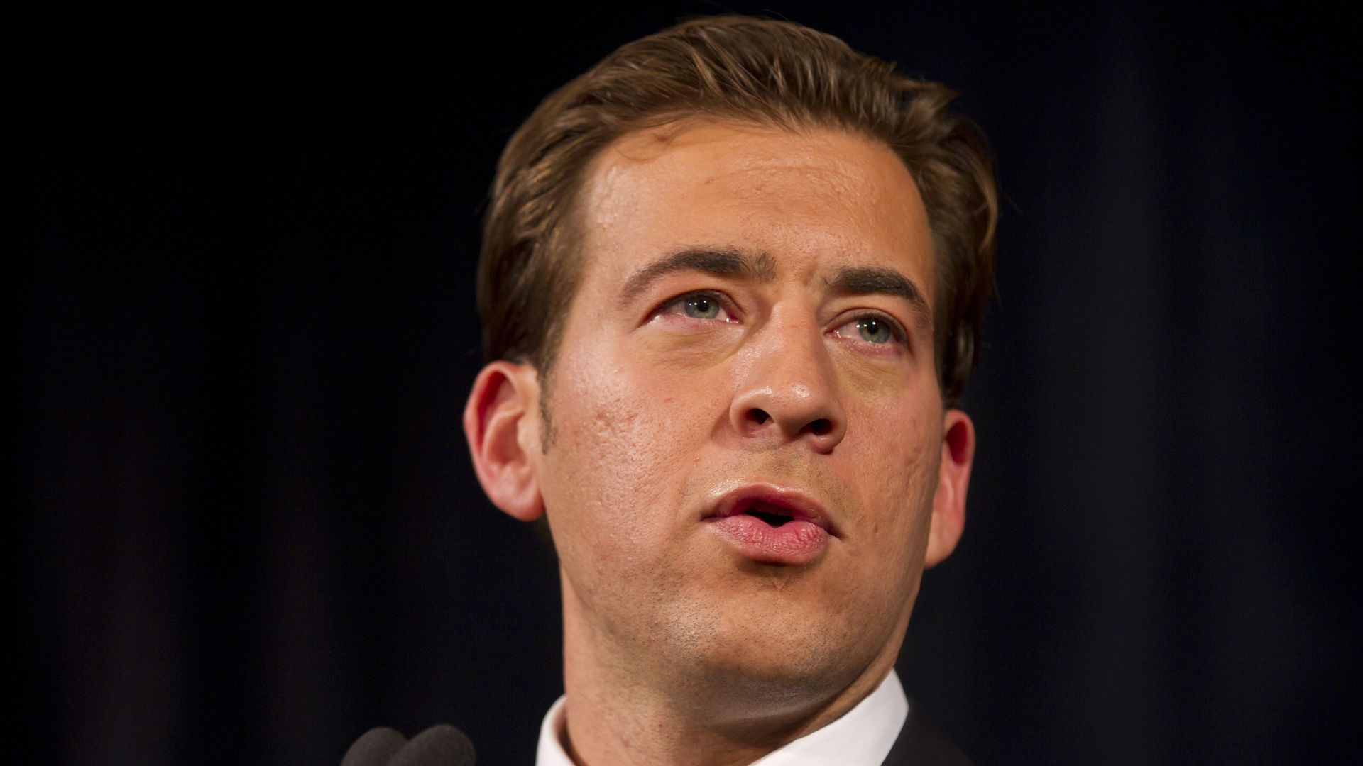 Photo of a man on podium.