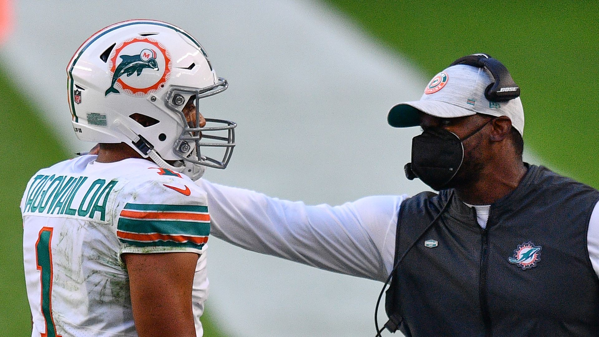 Dolphins quarterback Tua Tagovailoa and former head coach Brian Flores. 