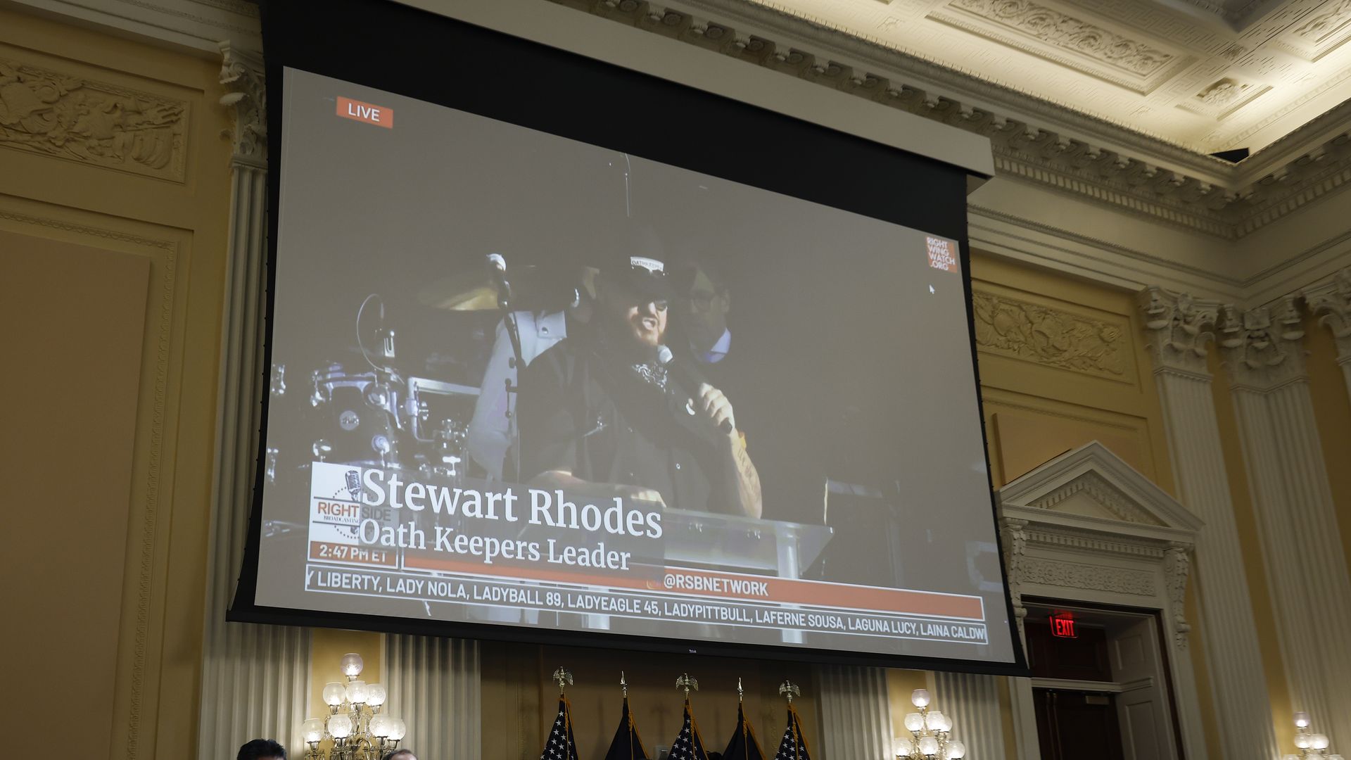 Oath Keepers founder Stewart Rhodes appears on a video screen 