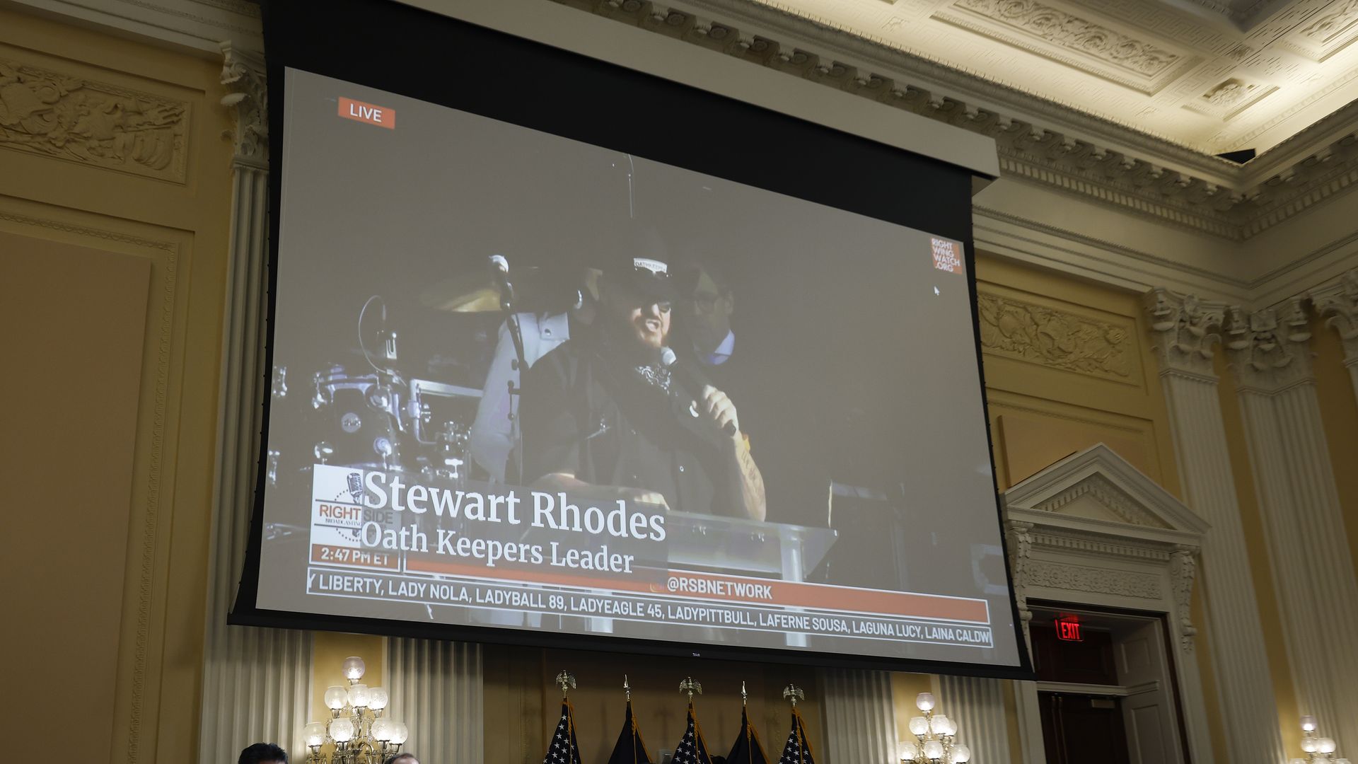 Oath Keepers founder Stewart Rhodes appears on a video screen