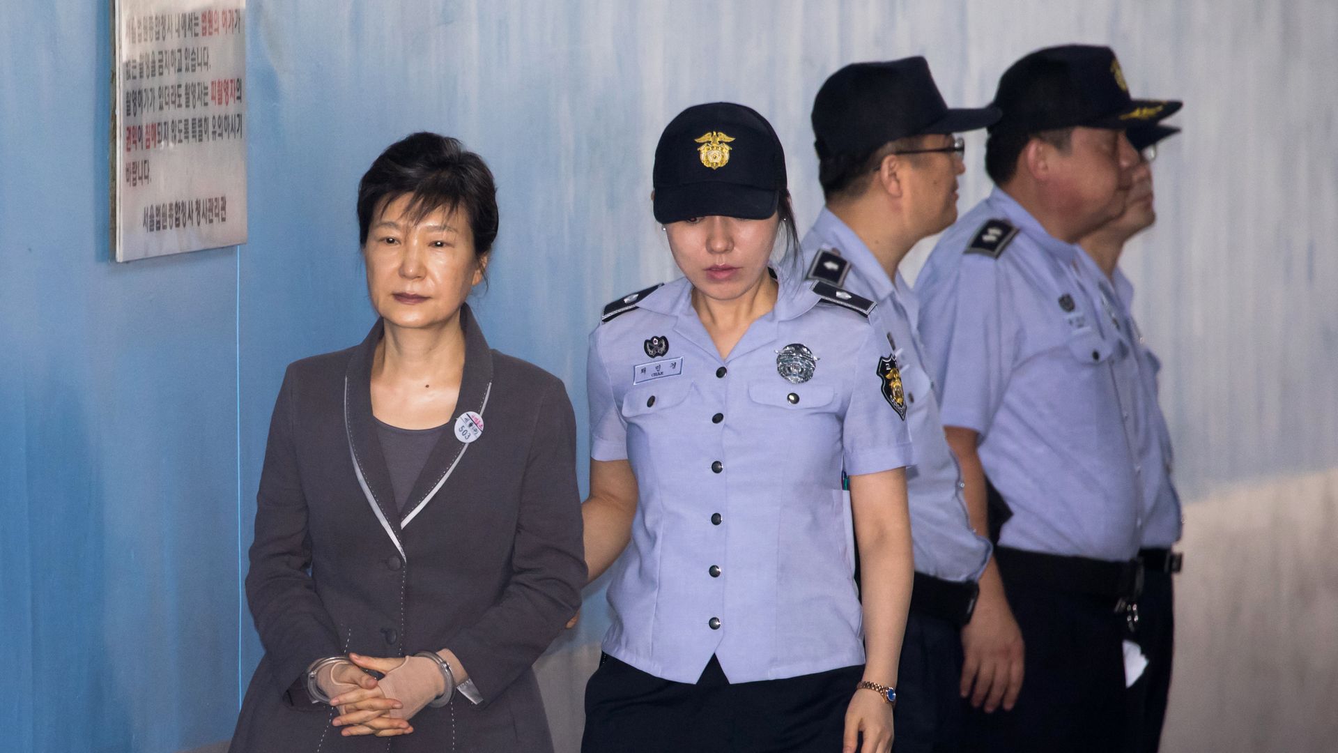 South Korean ex-President Park Geun-hye escorted by a prison guard