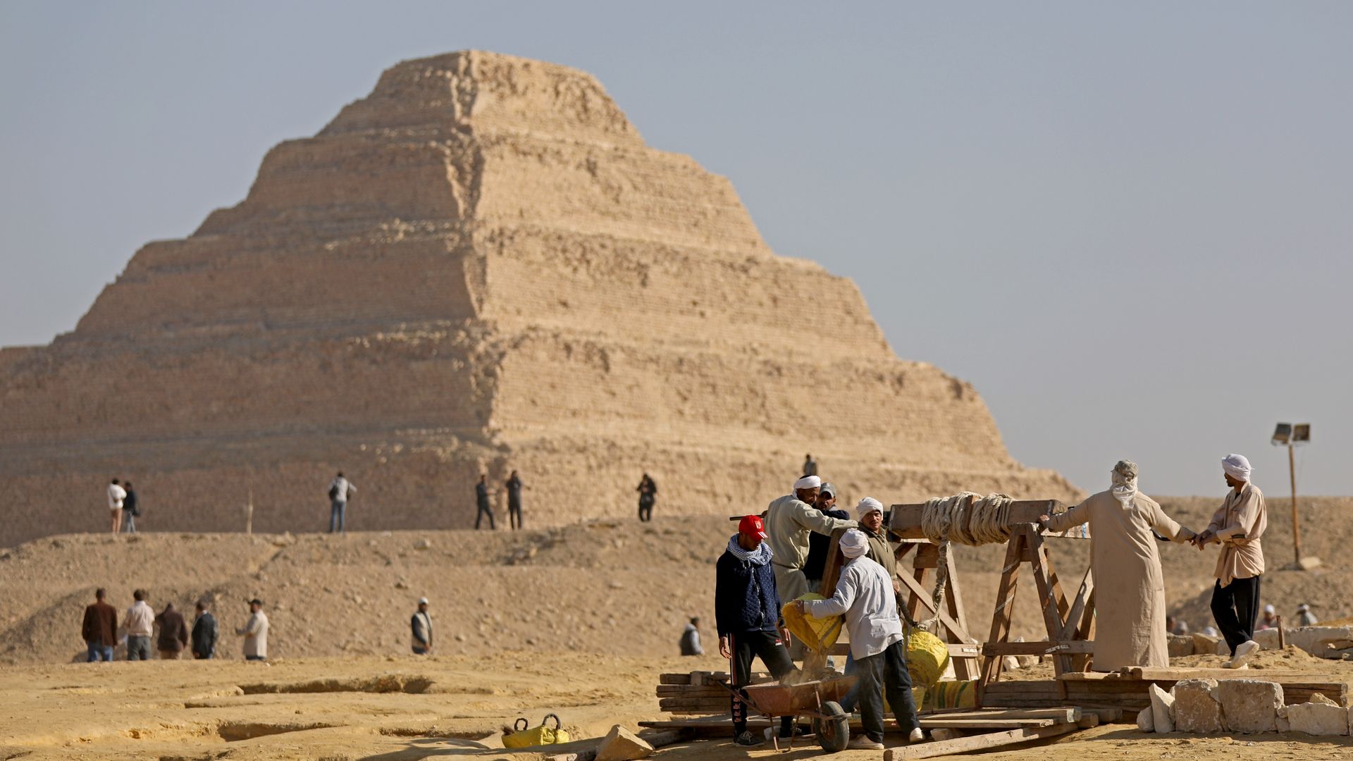 Egyptian archaeological workers excavating the site of the Step Pyramid of Djoser in Saqqara 