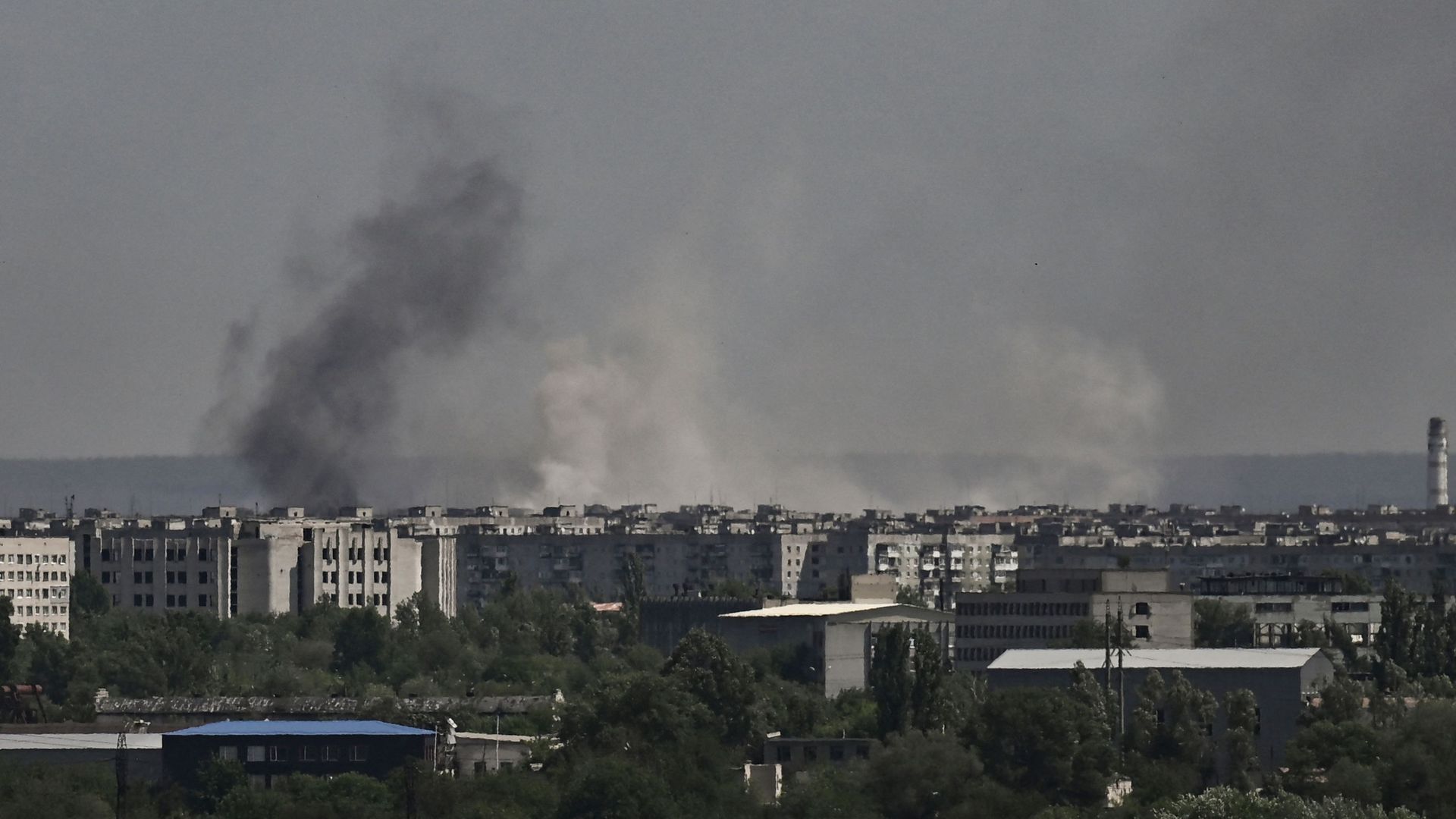  Smoke and dirt rise from the city of Severodonetsk, during shelling in the eastern Ukrainian region of Donbas, on May 26.