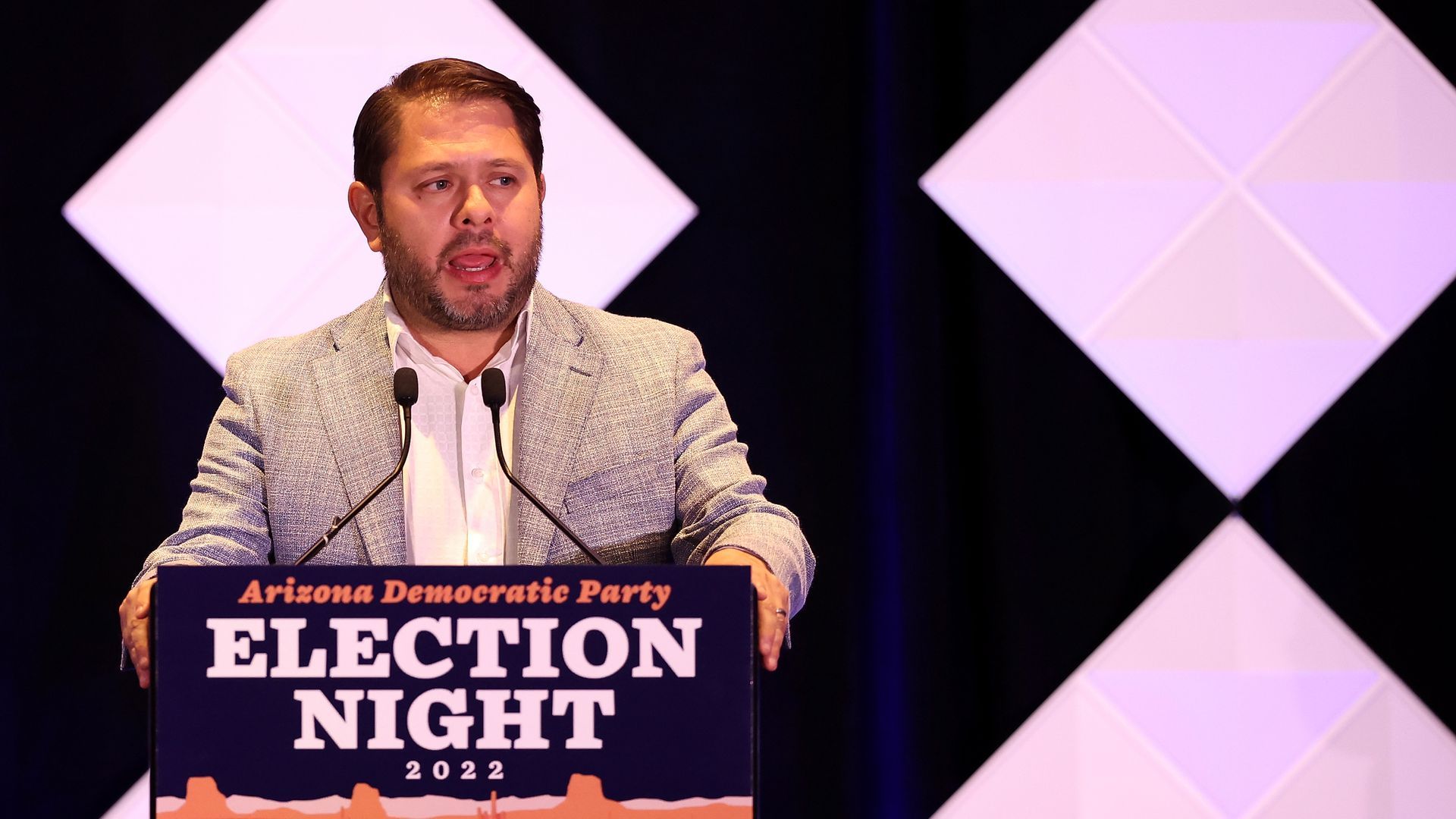 U.S. Rep. Ruben Gallego of Arizona stands at a podium with the Arizona Democratic Party