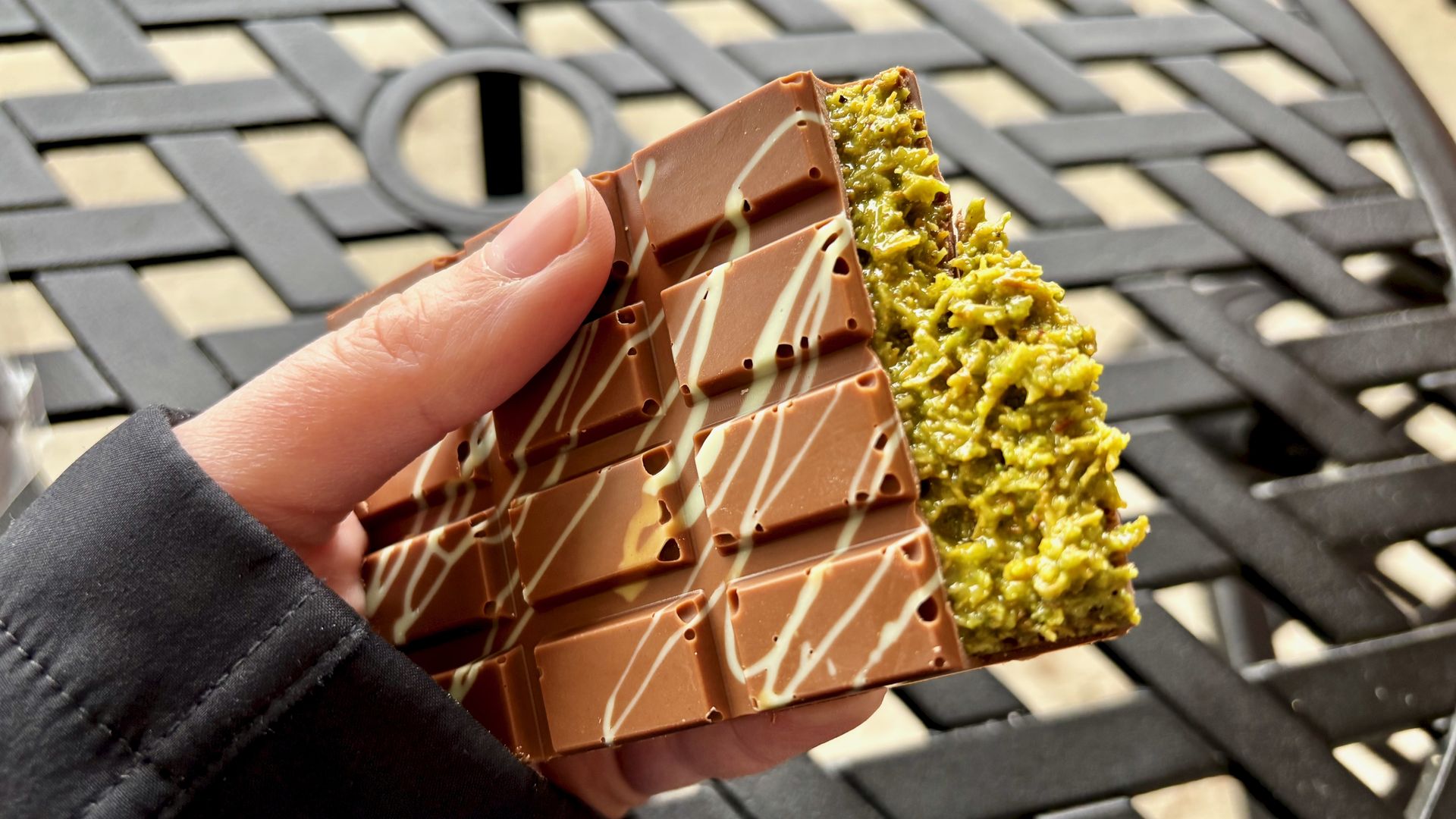 A close-up of a Dubai chocolate bar and its knafeh filling