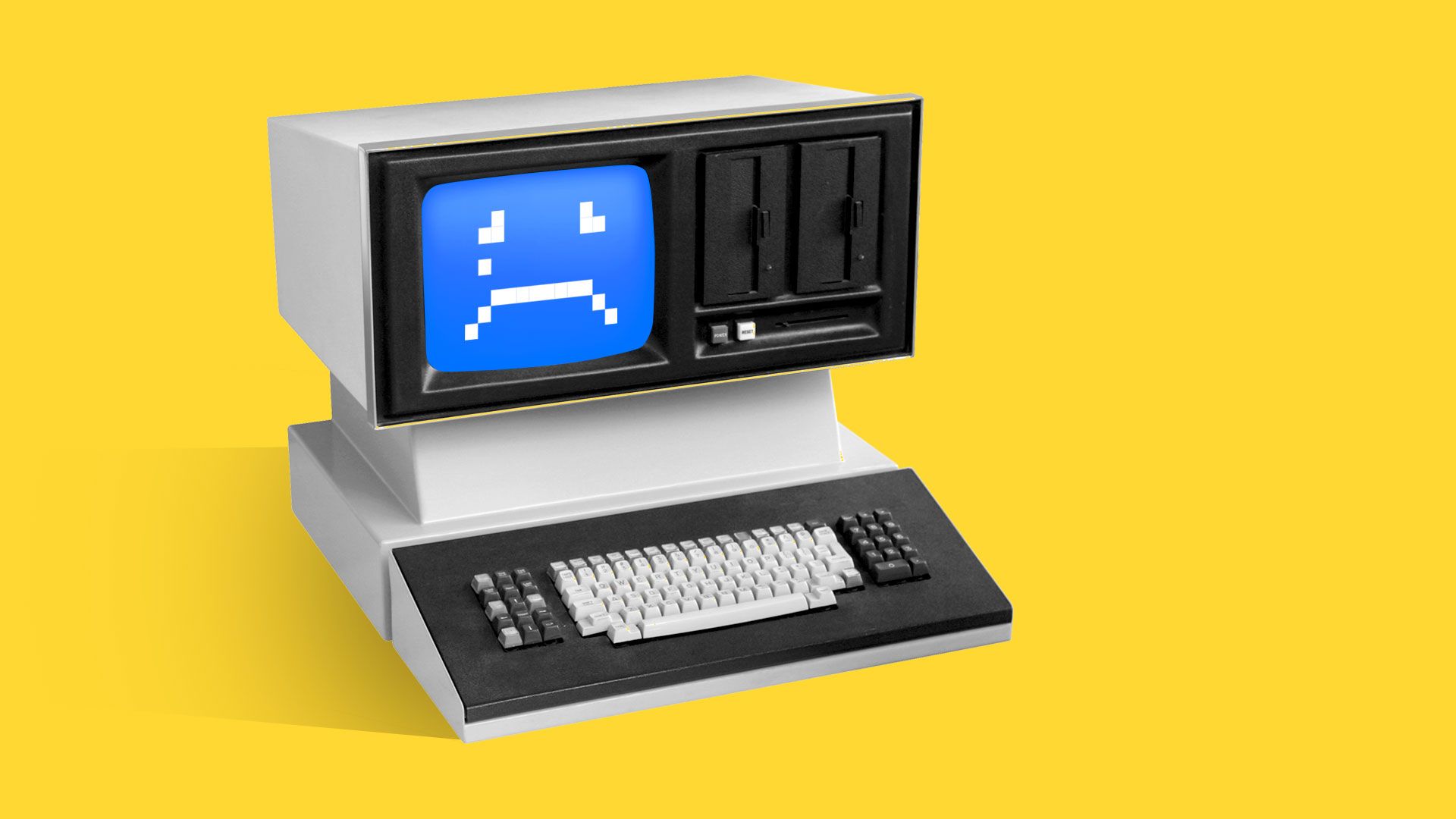 An 80s-era computer displays a pixellated crying face.