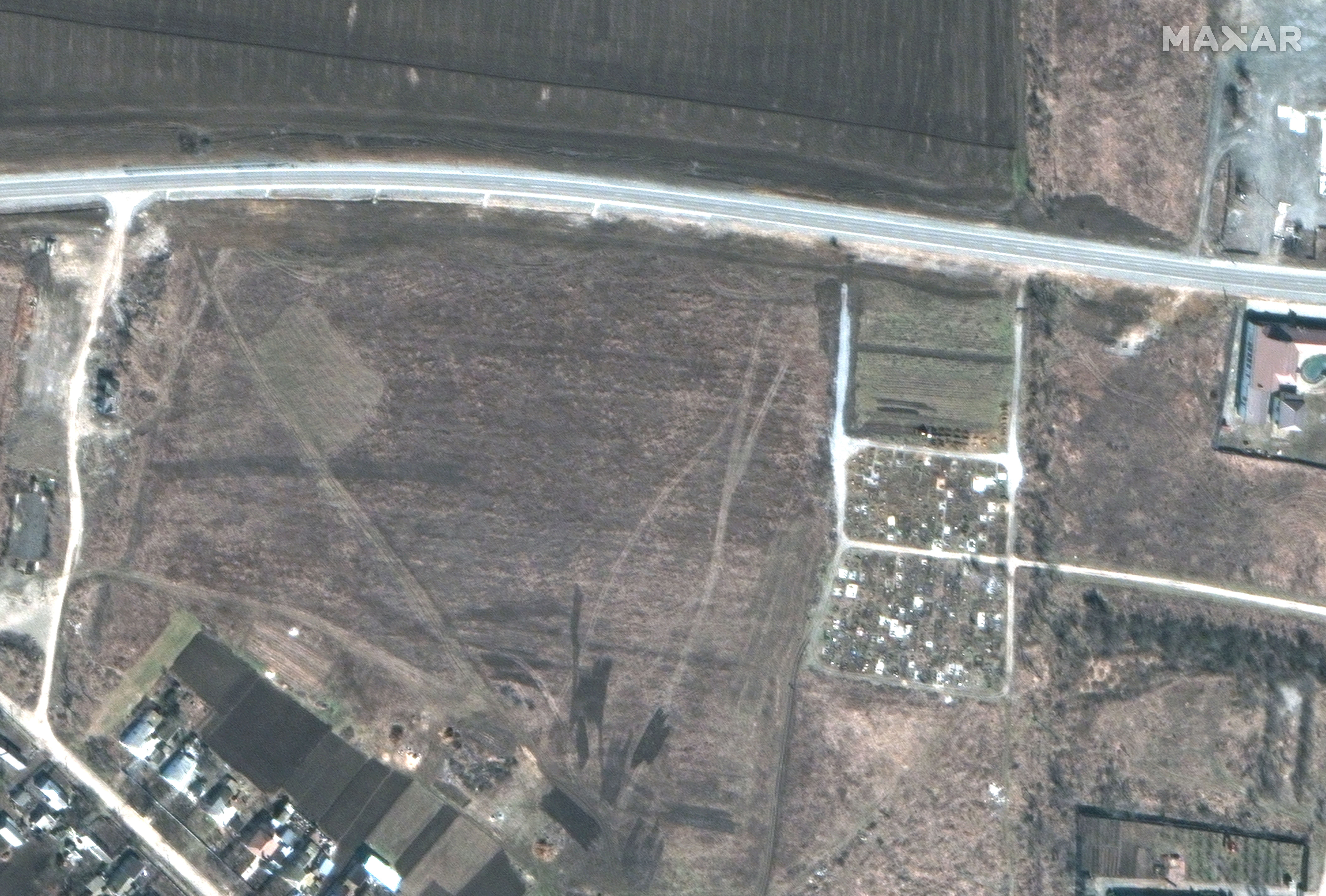 A satellite image of Munhush's cemetery captured on March 19 showing the early construction of gravesites.