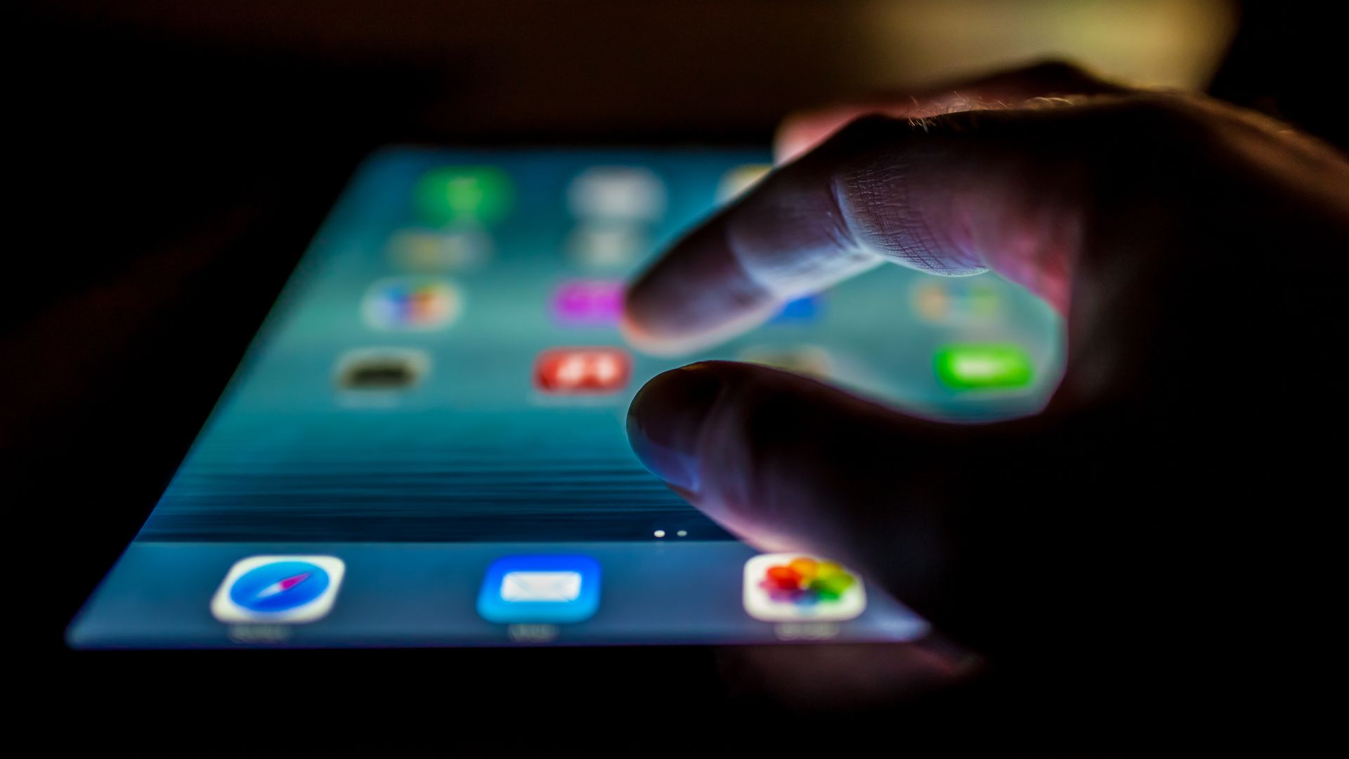 A person uses an iPad