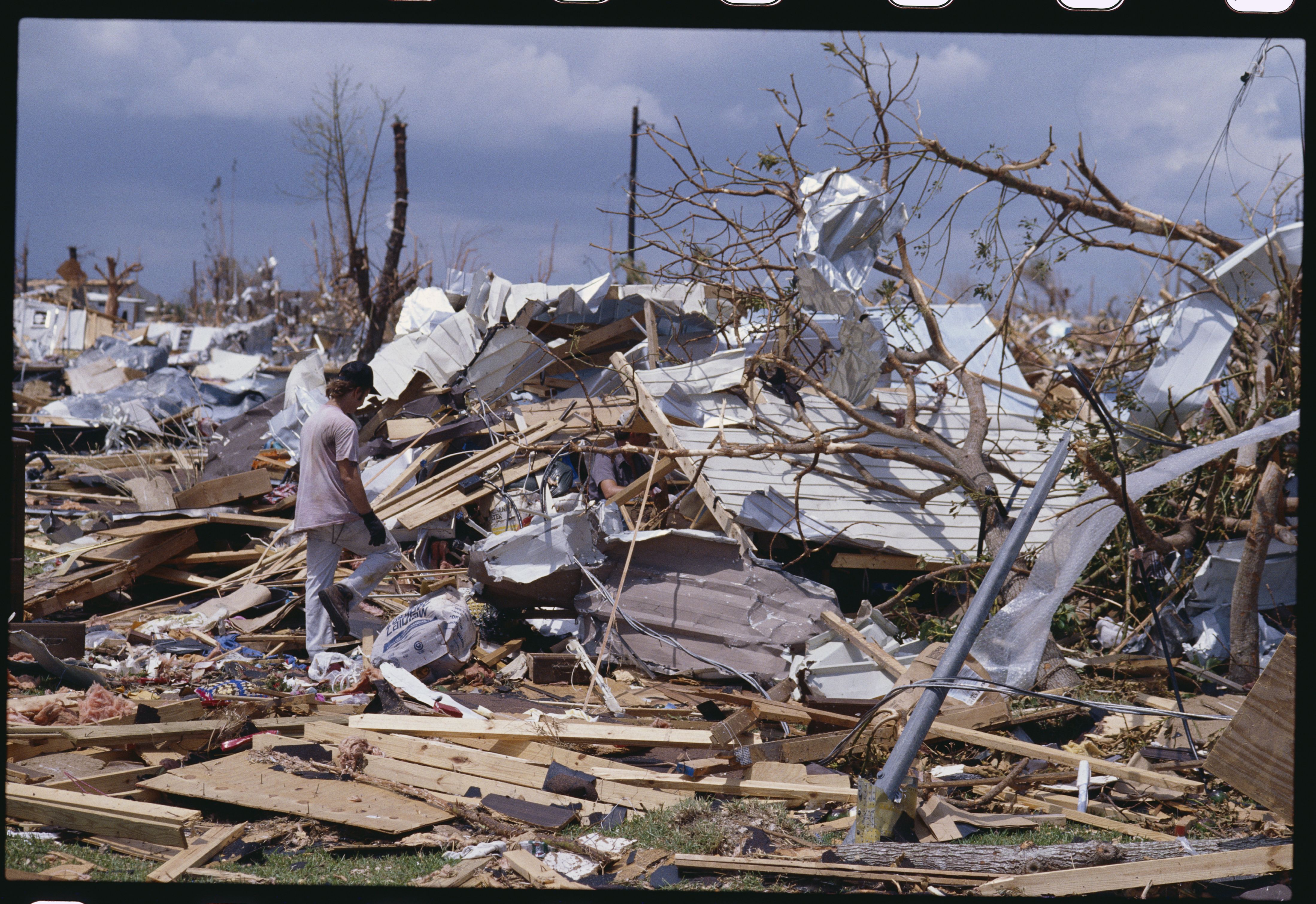 A Homestead resident returns to his home, looking for salvageable items following Hurricane Andrew