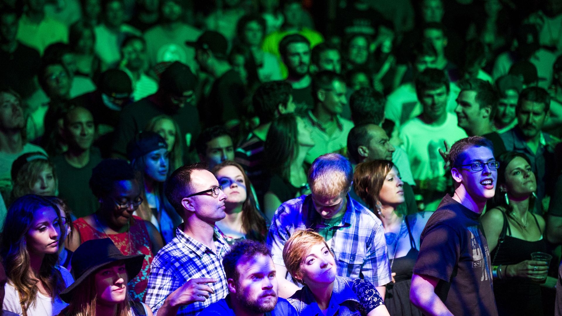 DENVER, CO - JULY 25: Fans dance to the music of People Under the Stairs perform at the Underground Music Showcase main stage along South Broadway during the Annual Underground Music Showcase on Friday, July 25, 2014 in Denver, Colorado. The music festival, which features more than 400 bands playing