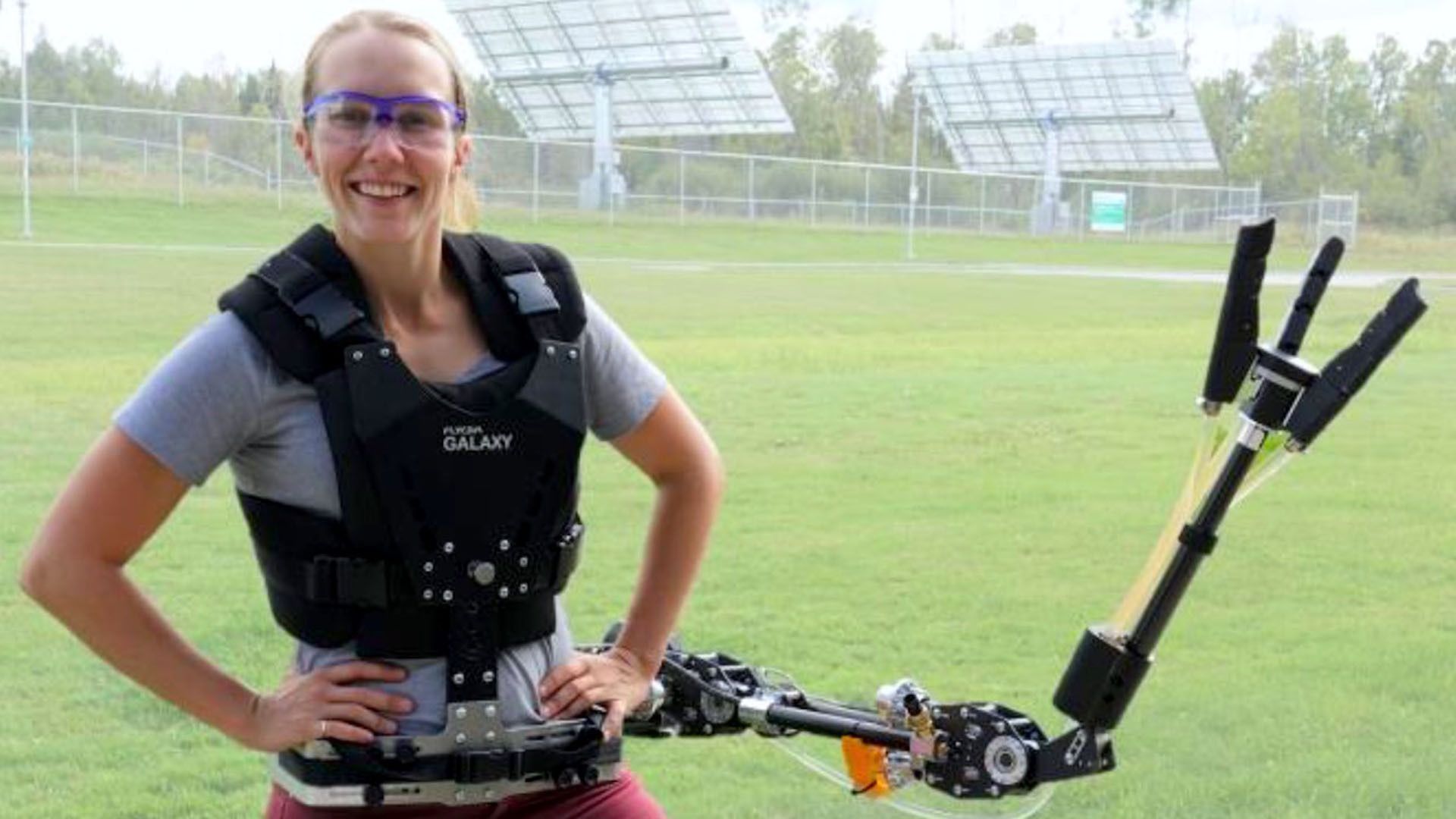 Image of a scientist using robot arms