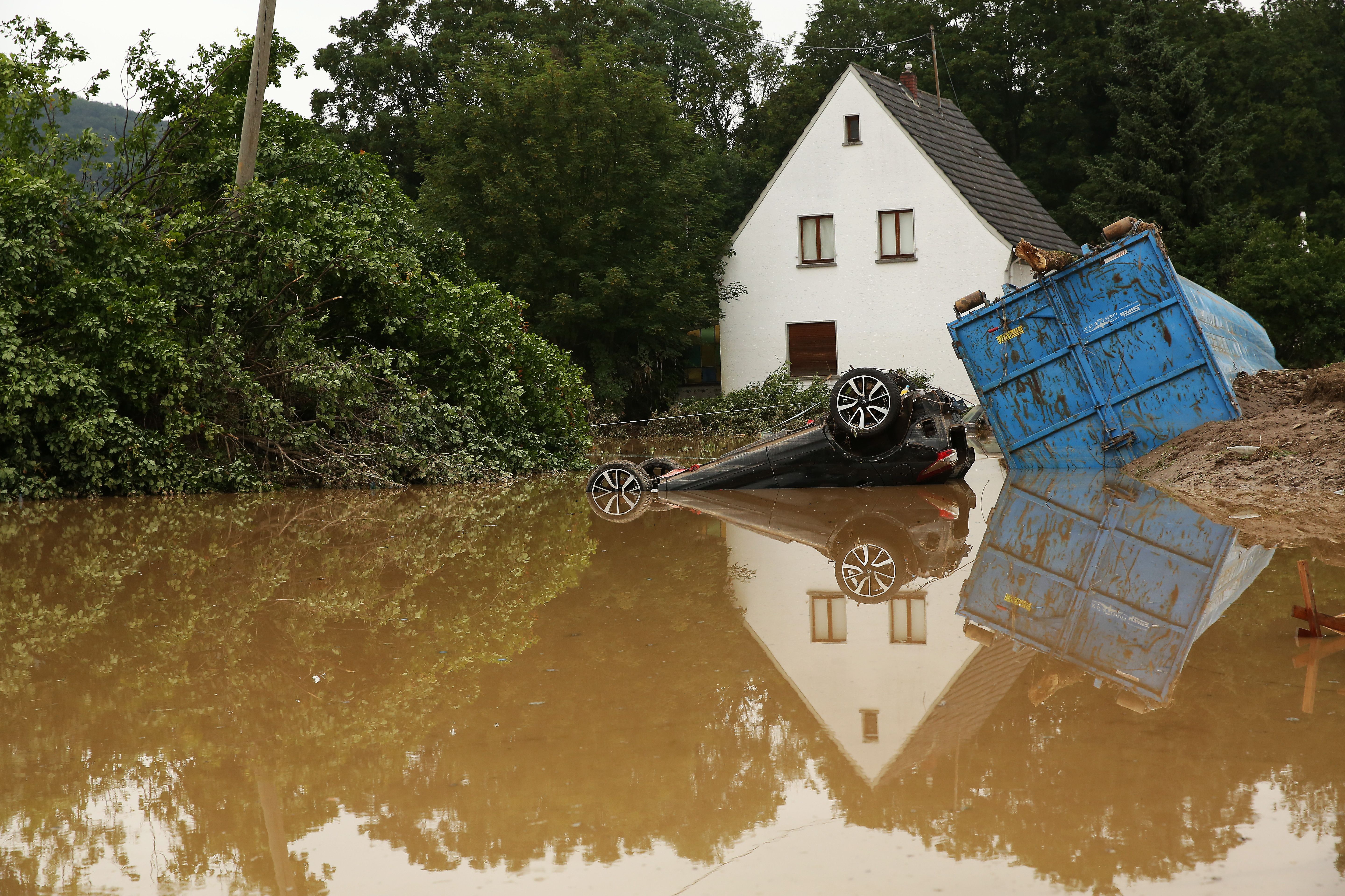 A car sits sunken in a deluged area after a major flood in the Ahrlweiler district of Germany's mountainous Eifel area.