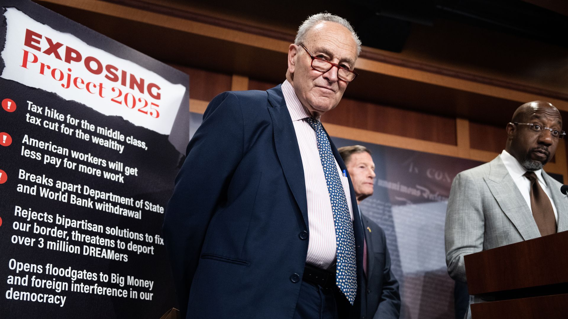  Senate Majority Leader Charles Schumer, D-N.Y., Sens. Raphael Warnock, D-Ga., right, and Richard Blumenthal, D-Conn., conduct a news conference in the U.S. Capitol on the negative effects of Project 2025, on Thursday, September 19, 2024.