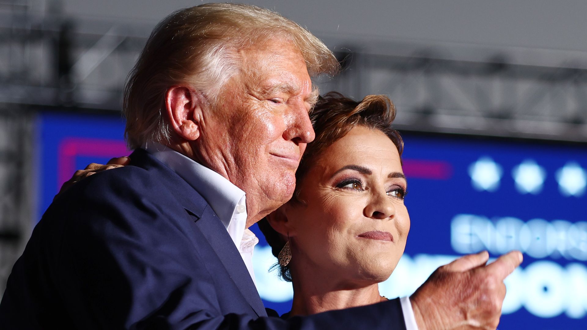 Former President Donald Trump standing next to GOP governor nominee Kari Lake