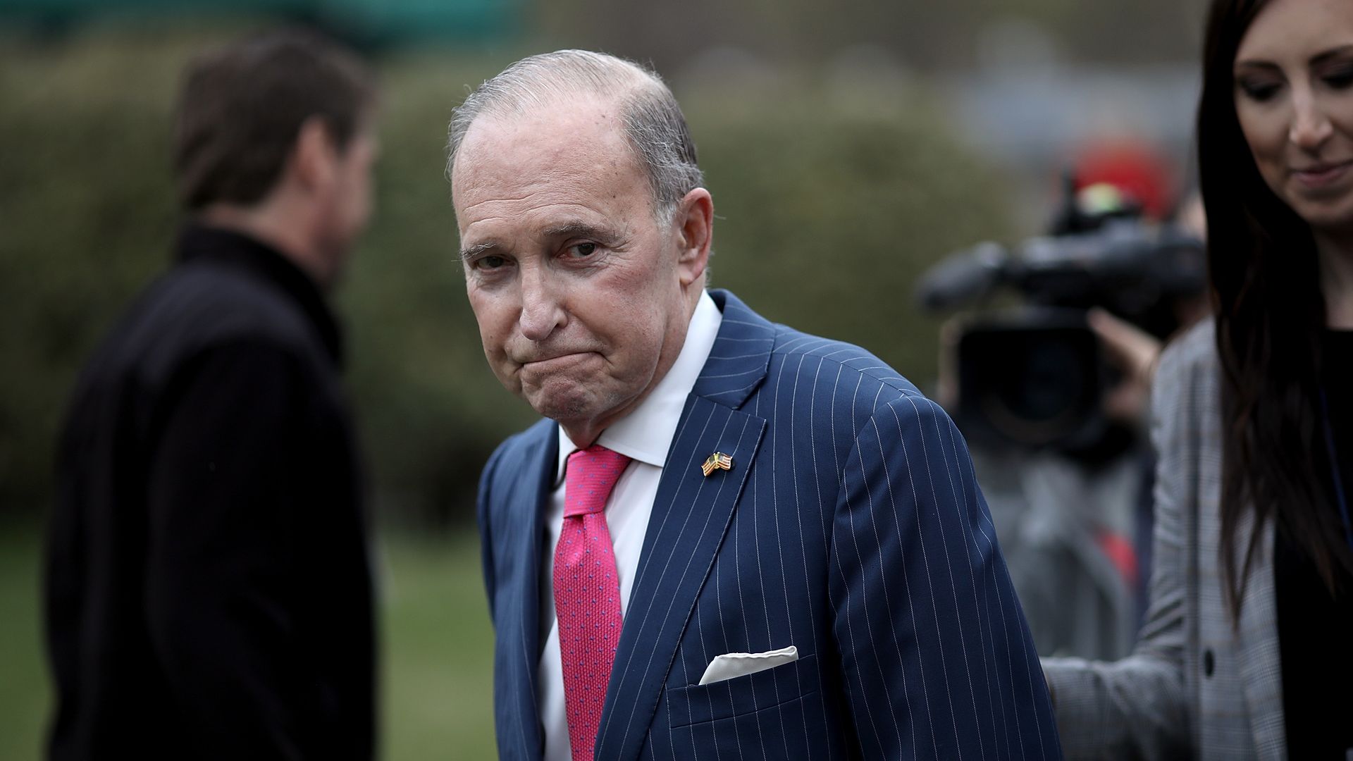Larry Kudlow in a sea of reporters