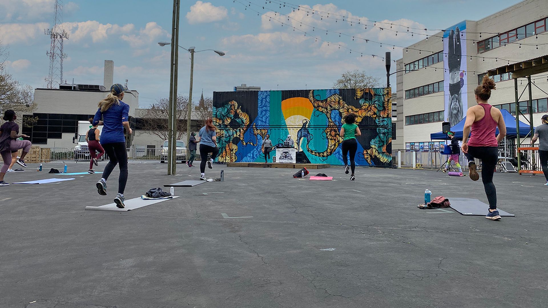 people working out in a parking lot