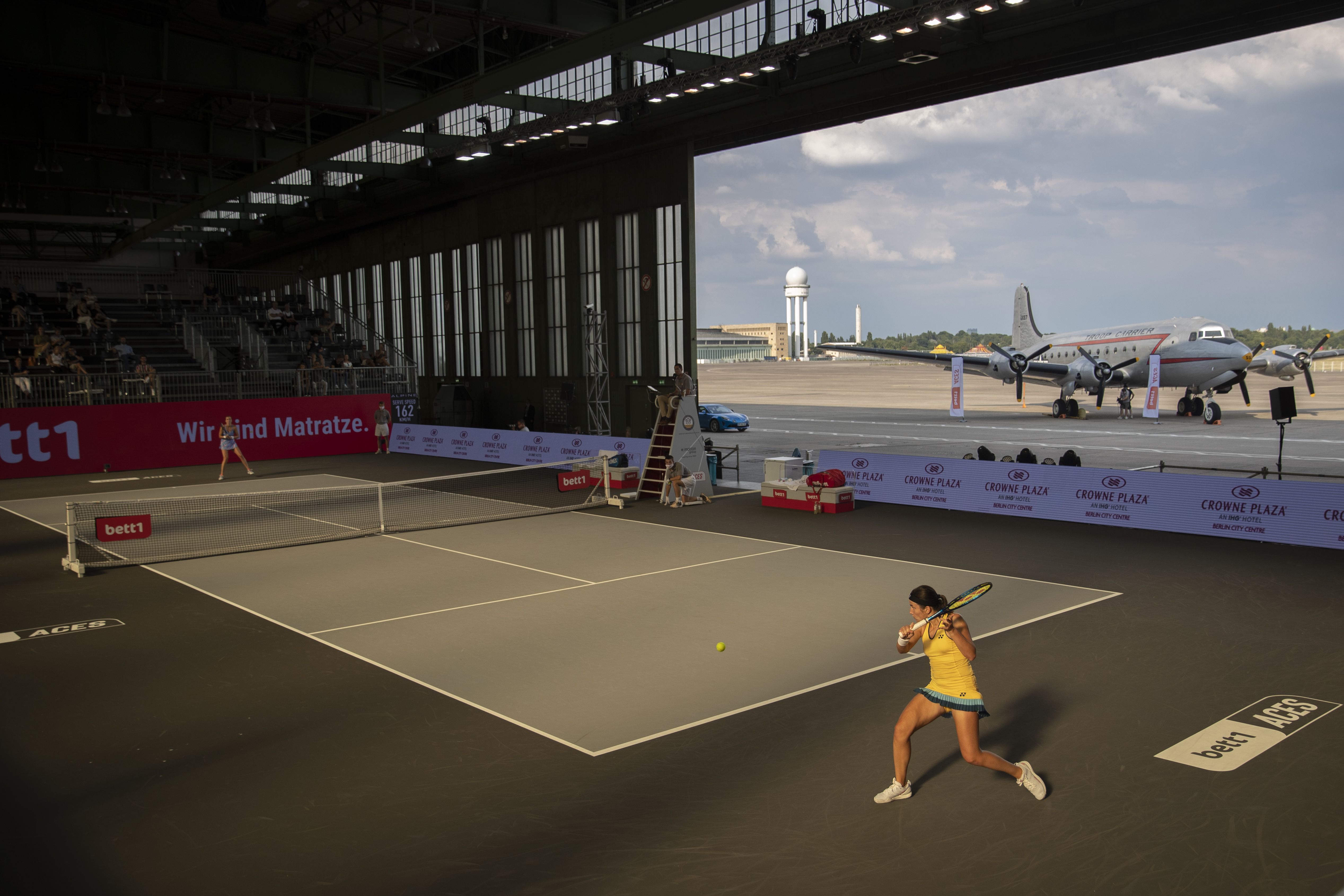 Tennis in an airplane hangar