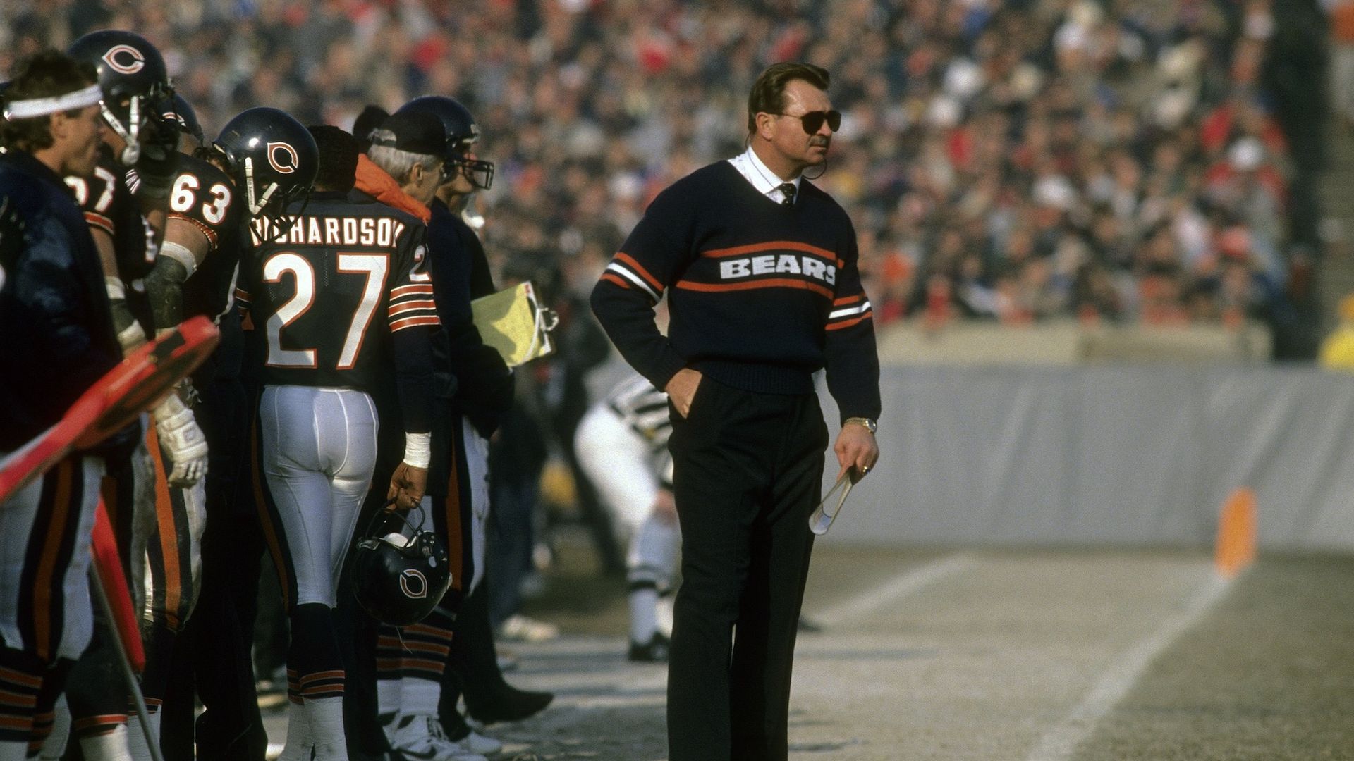 Chicago Bears coach Mike Ditka on the sidelines wearing a Bears sweater.