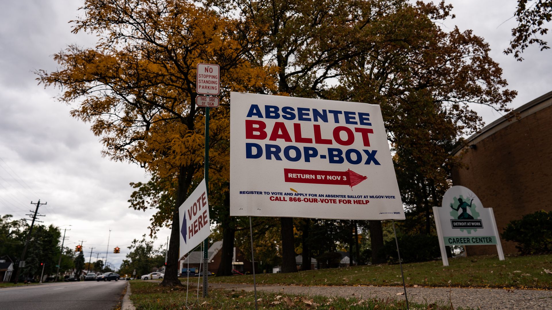 A sign directing voters to the absentee ballot drop-box at one of the Satellite Voting Center inside Northwest Activity Center in Michigan.