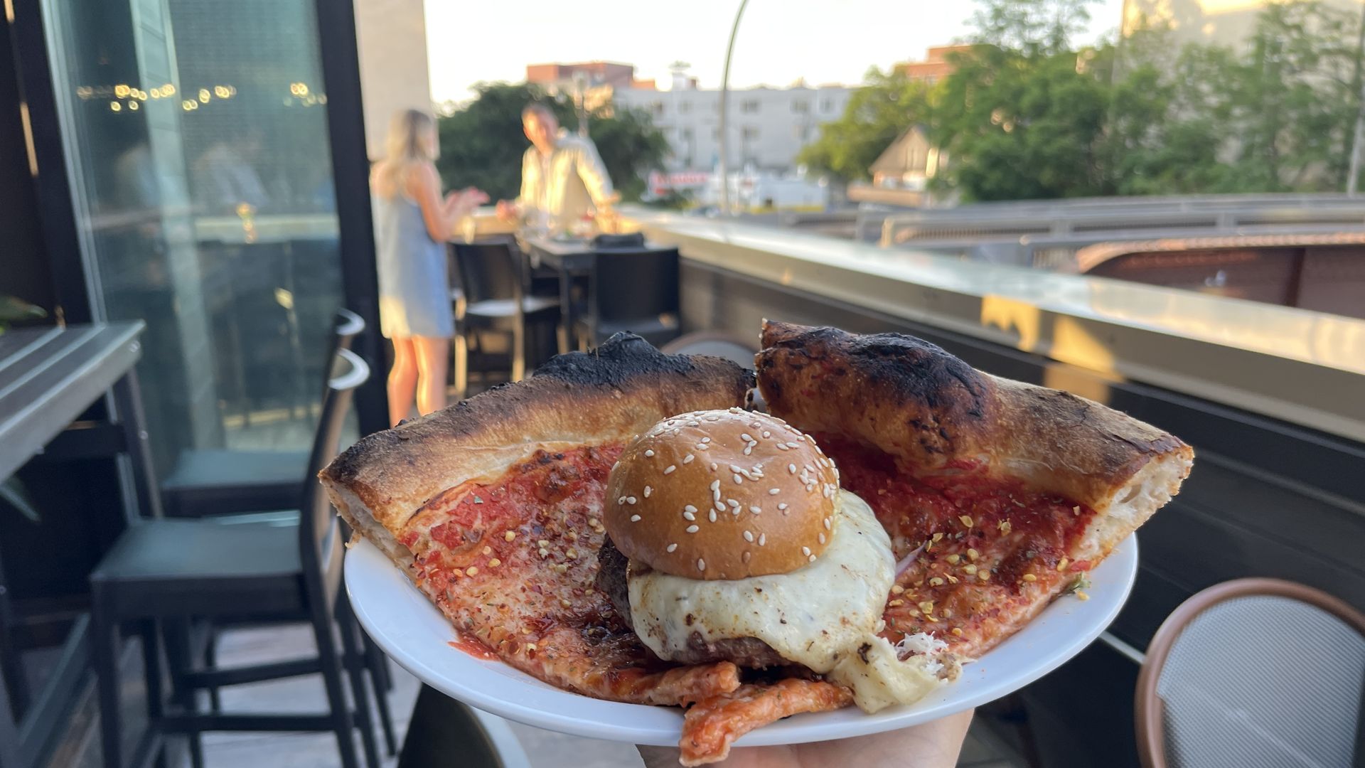 pizza and a burger on a plate