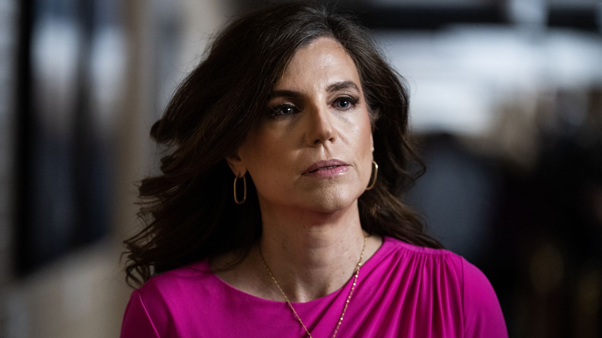 Rep. Nancy Mace, wearing a magenta dress and a member pin.