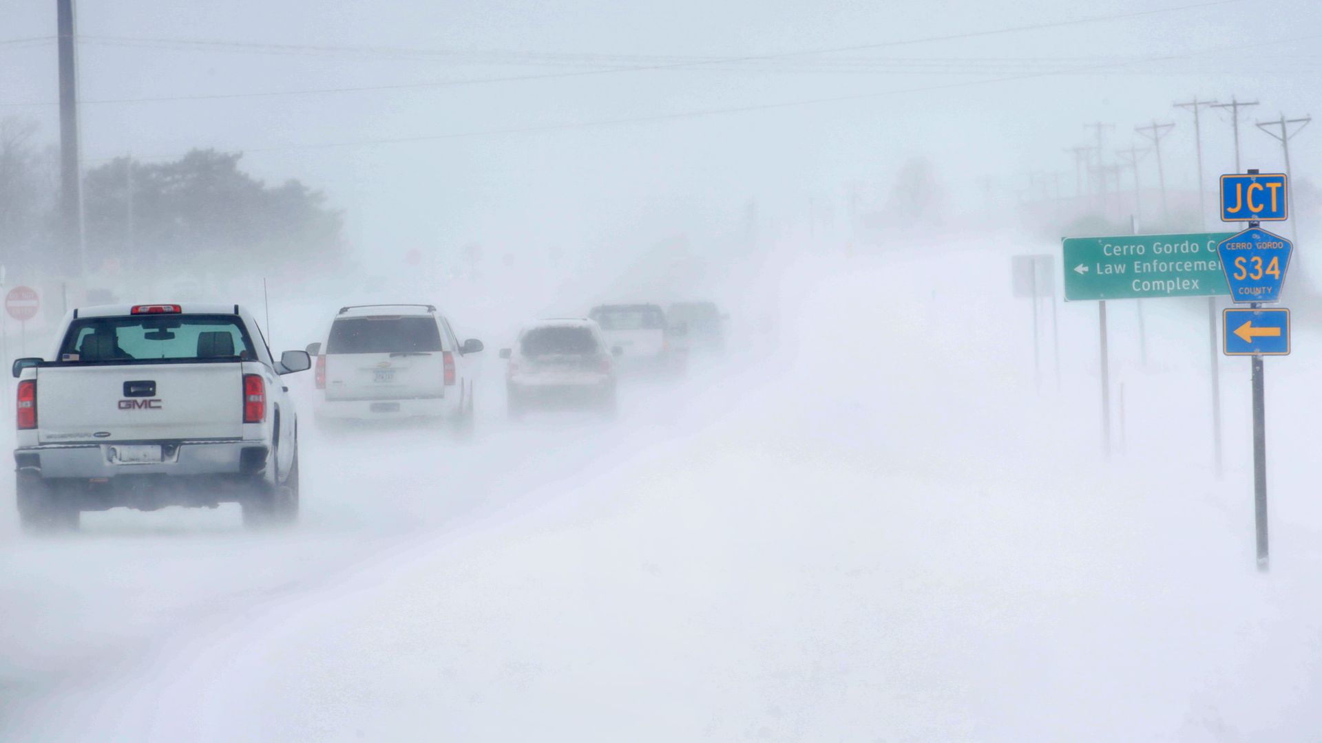 Motorists navigate an ice and snow-covered road on November 27, 2019 in Mason City, Iowa. 