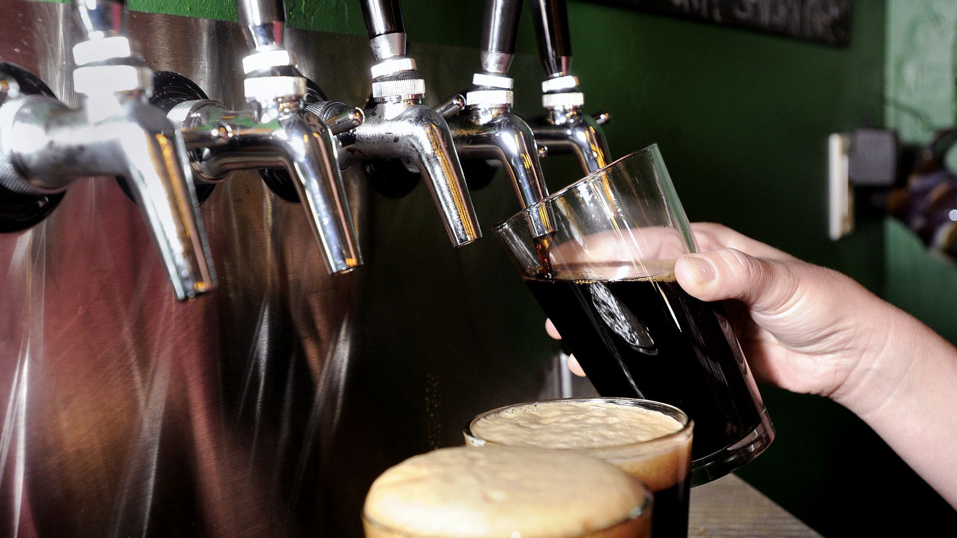 Beer pouring from a tap. Photo: Jeremy Papasso/Boulder Daily Camera via Getty Images