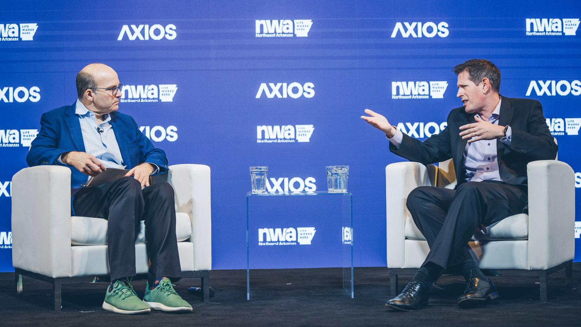 University of Arkansas' Greenhouse Outdoor Recreation Program director Phil Shellhammer speaks with Axios' Mike Allen, left, about the recreation startup community at an event last November.