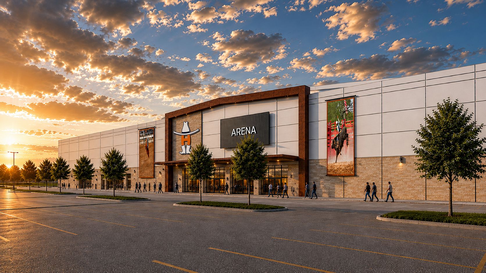 Sunset view of a large shopping arena building with a central ARENA sign, cowboy logo, white facade, and tall banners. Trees line the entrance as people walk toward glass doors in a parking lot.