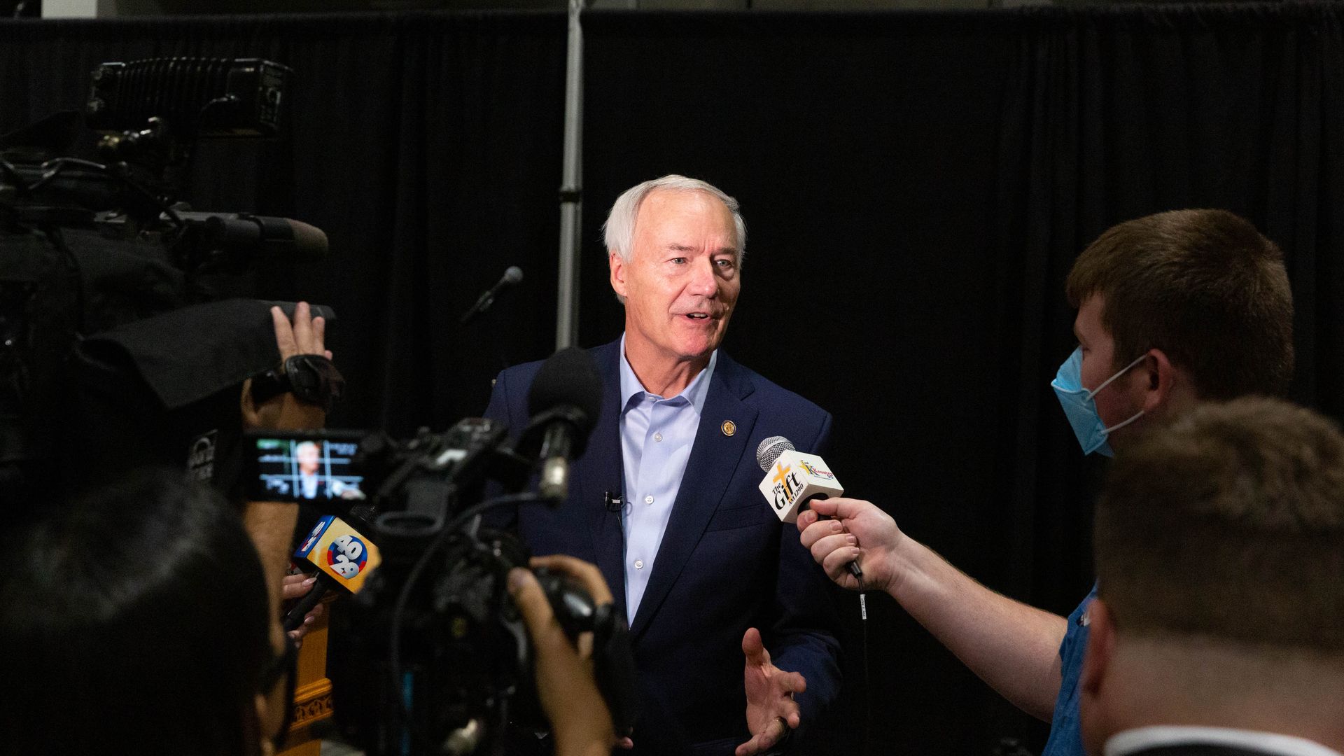 Asa Hutchinson, governor of Arkansas, speaks with members of the media 