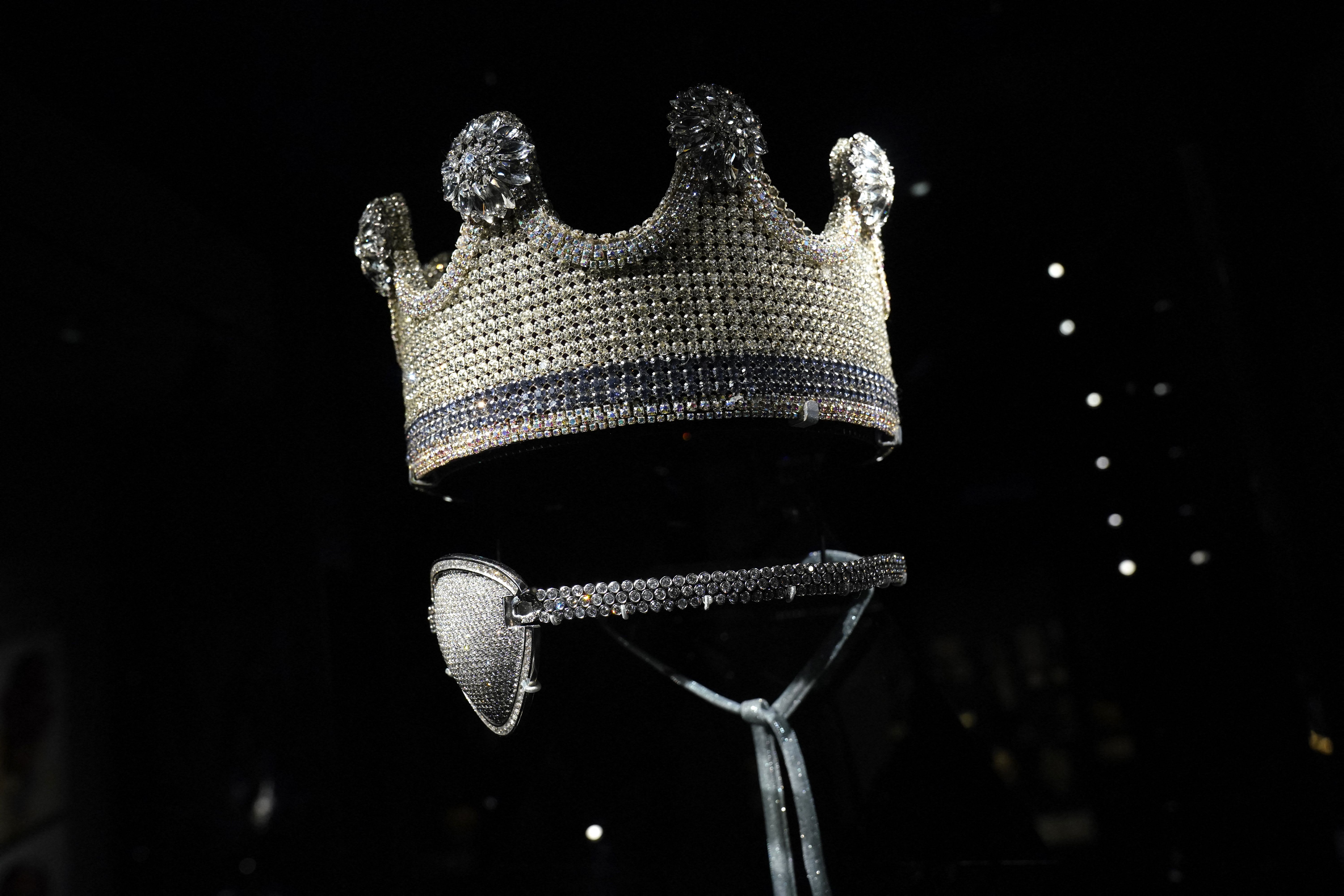 Slick Rick's crown and Eye Patch is displayed during a press preview May 8, 2024 in New York for "Ice Cold: An Exhibition of Hip-Hop Jewelry" at the American Museum of Natural History.