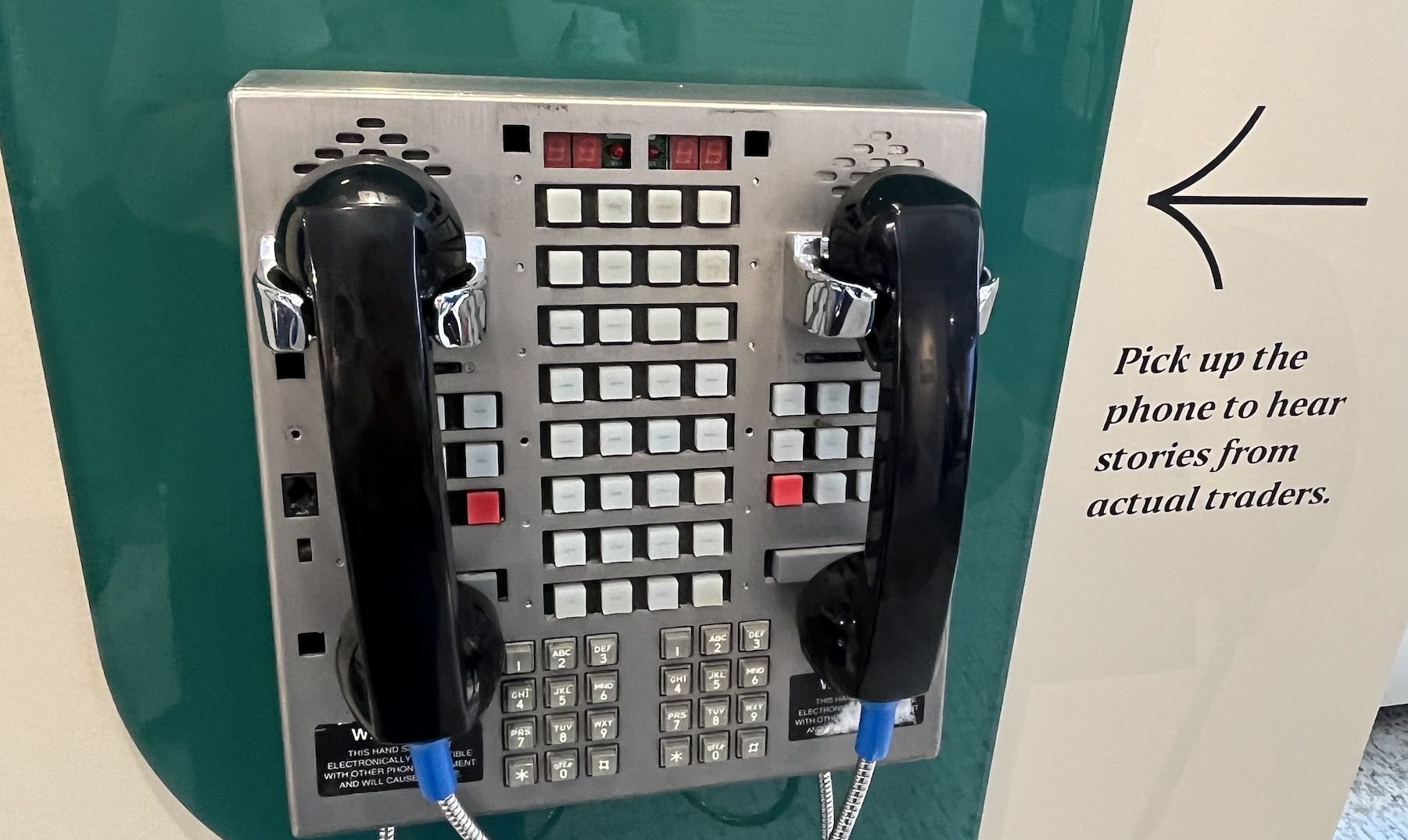 Two old pay phone style telephones.