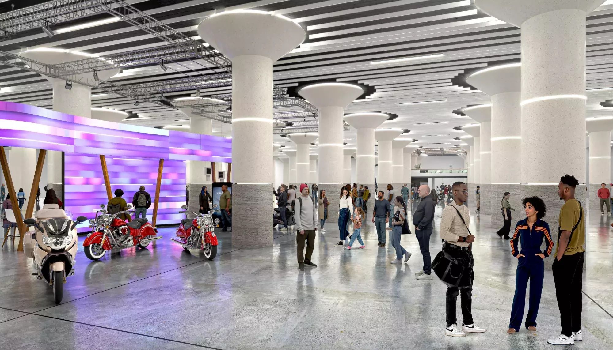 The concourse of an NHL arena brightly lit with white pillars