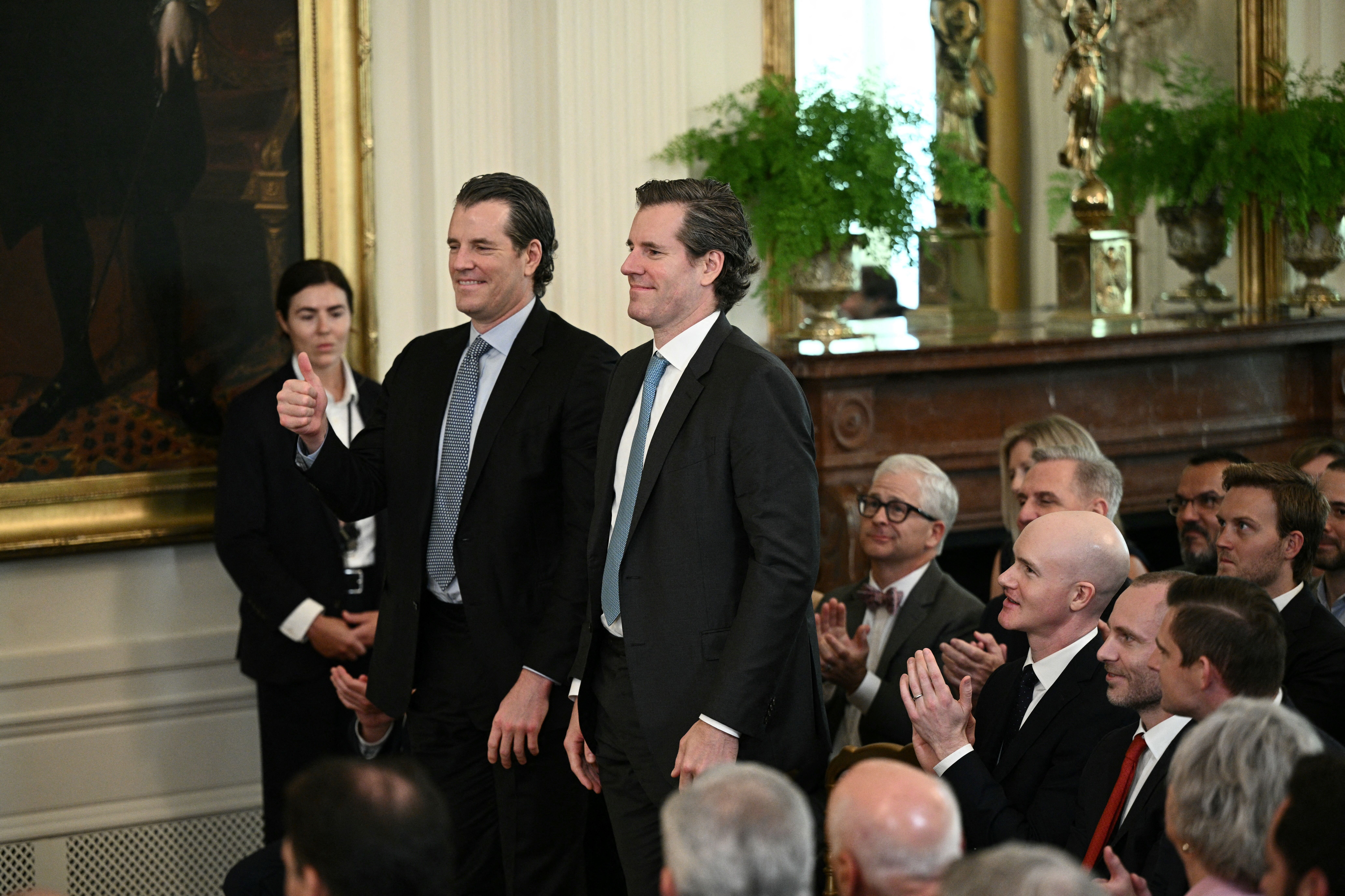 Entrepreneur twins Tyler Winklevoss (left) and Cameron Winklevoss at the signing of stablecoin legislation in July. 