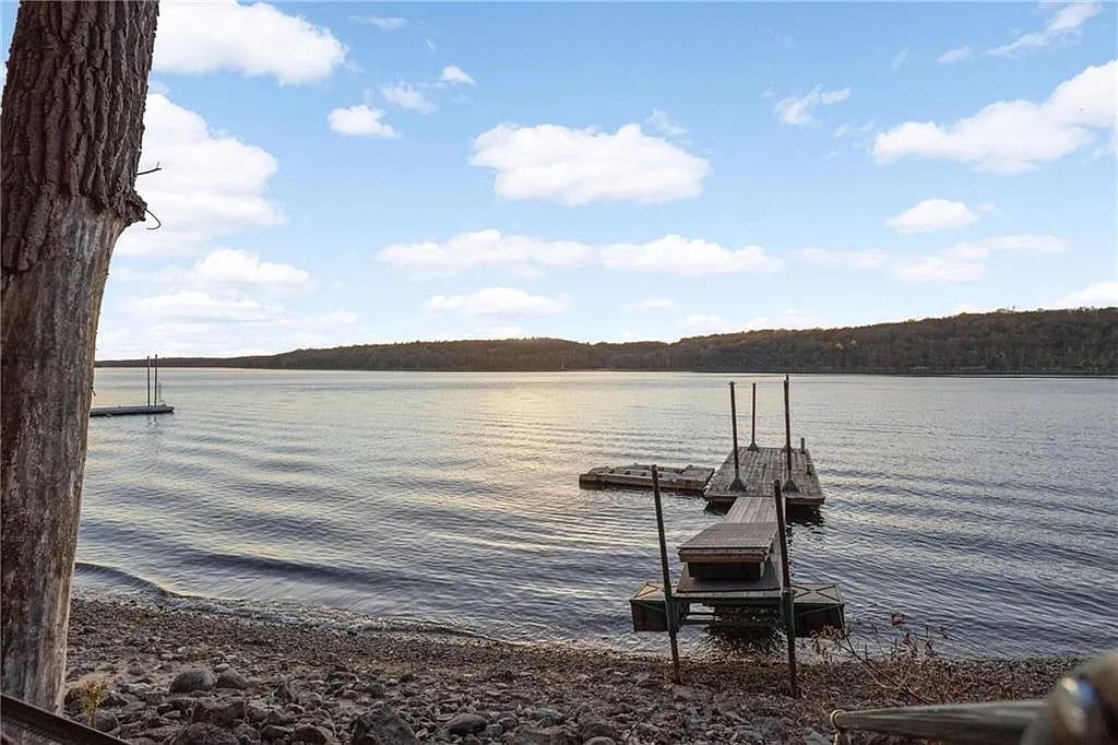 A dock in a river on a sunny day. 