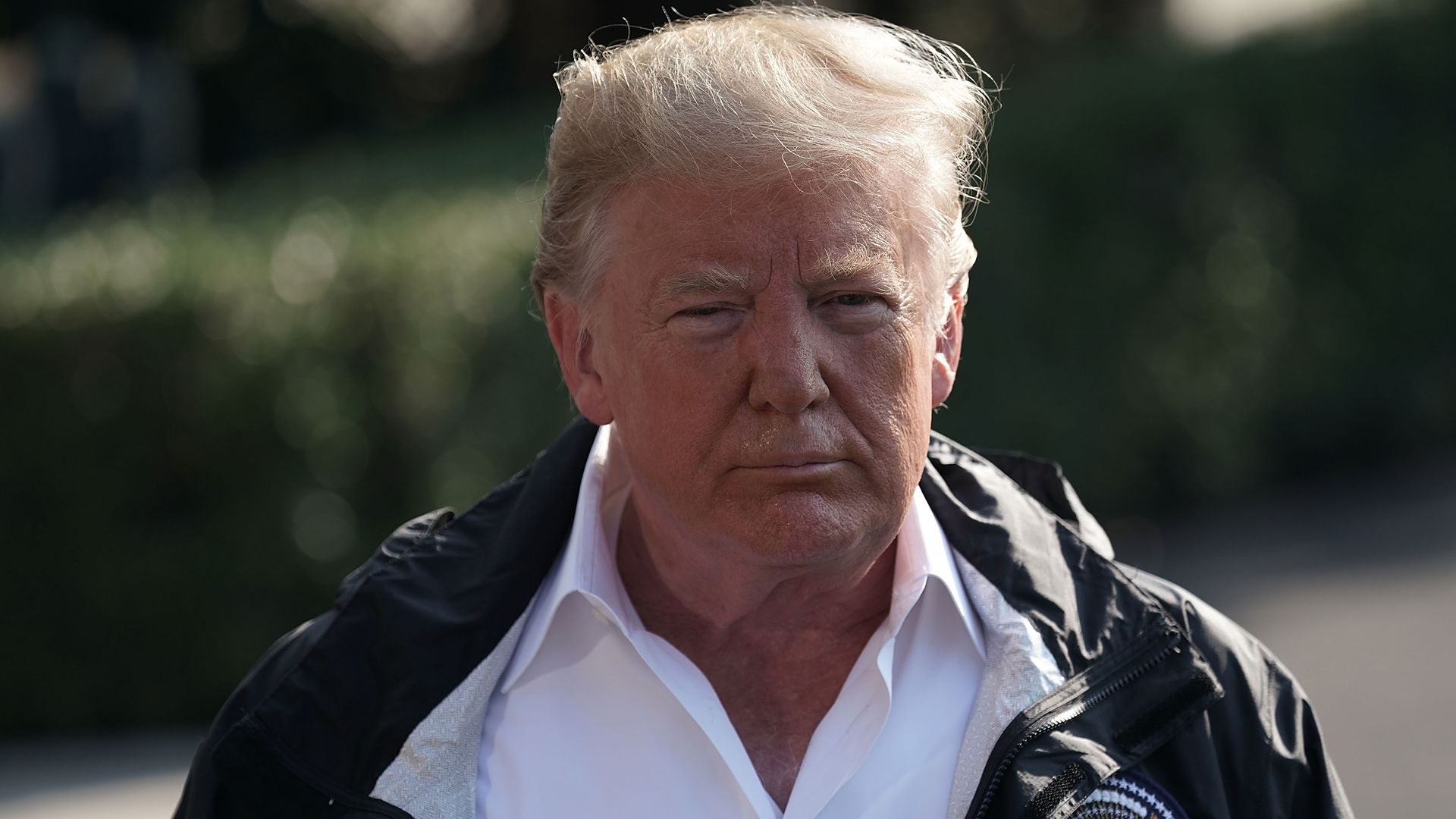 Donald Trump stands on the south lawn of the White House in front of reporters
