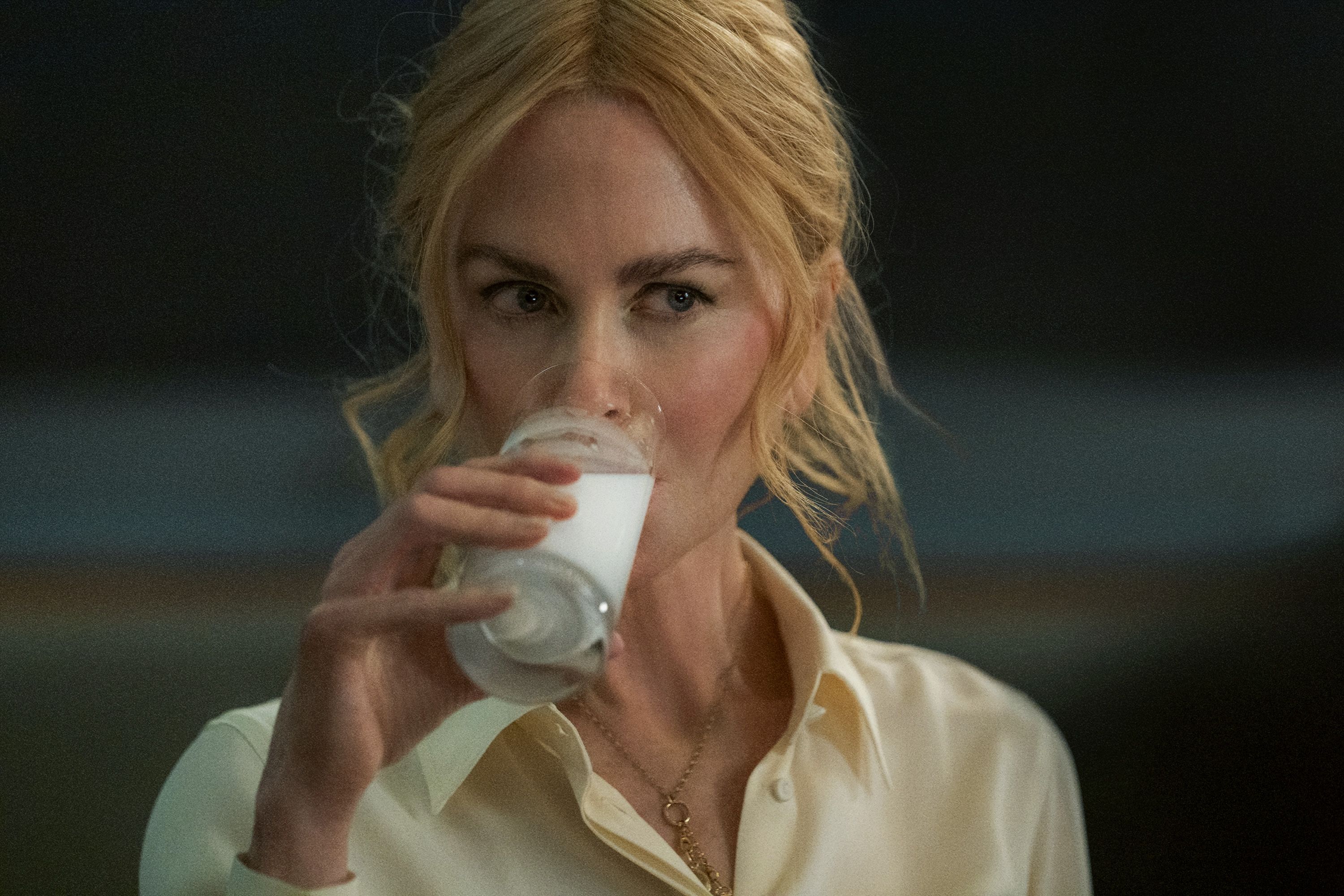 Nicole Kidman drinking a glass of milk in a scene from the movie "Babygirl." 