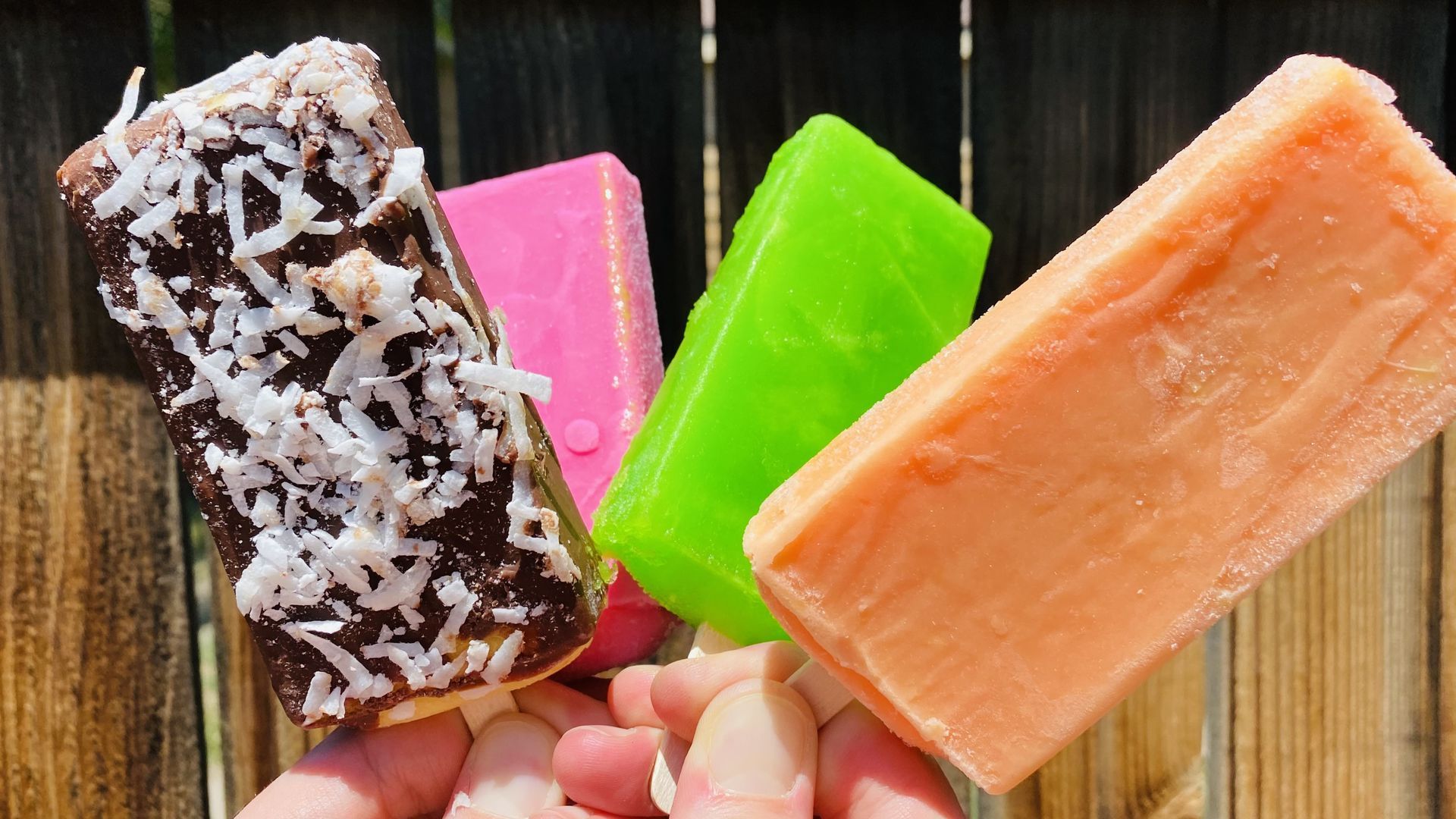 Four colorful Mexican-style popsicles.