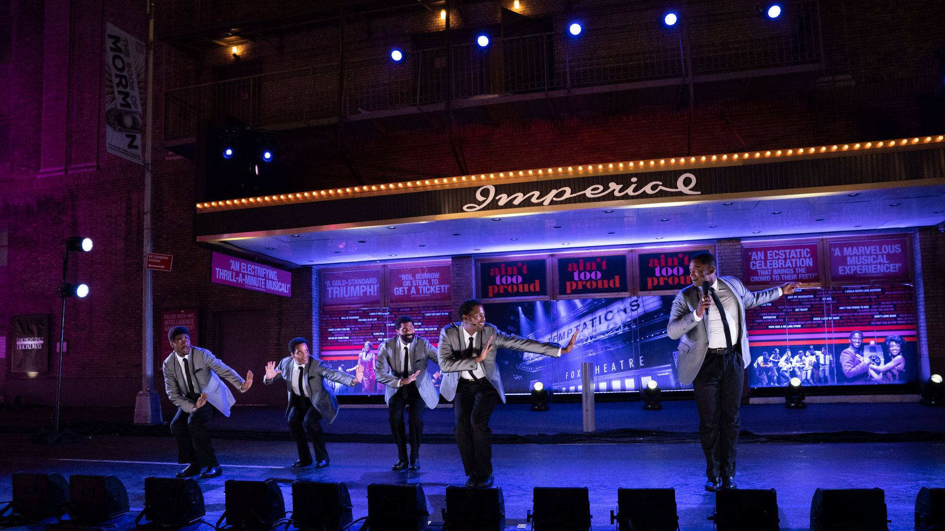 Four actors playing members of the band The Tempations perform on stage during the Broadway Musical "Ain't Too Proud."