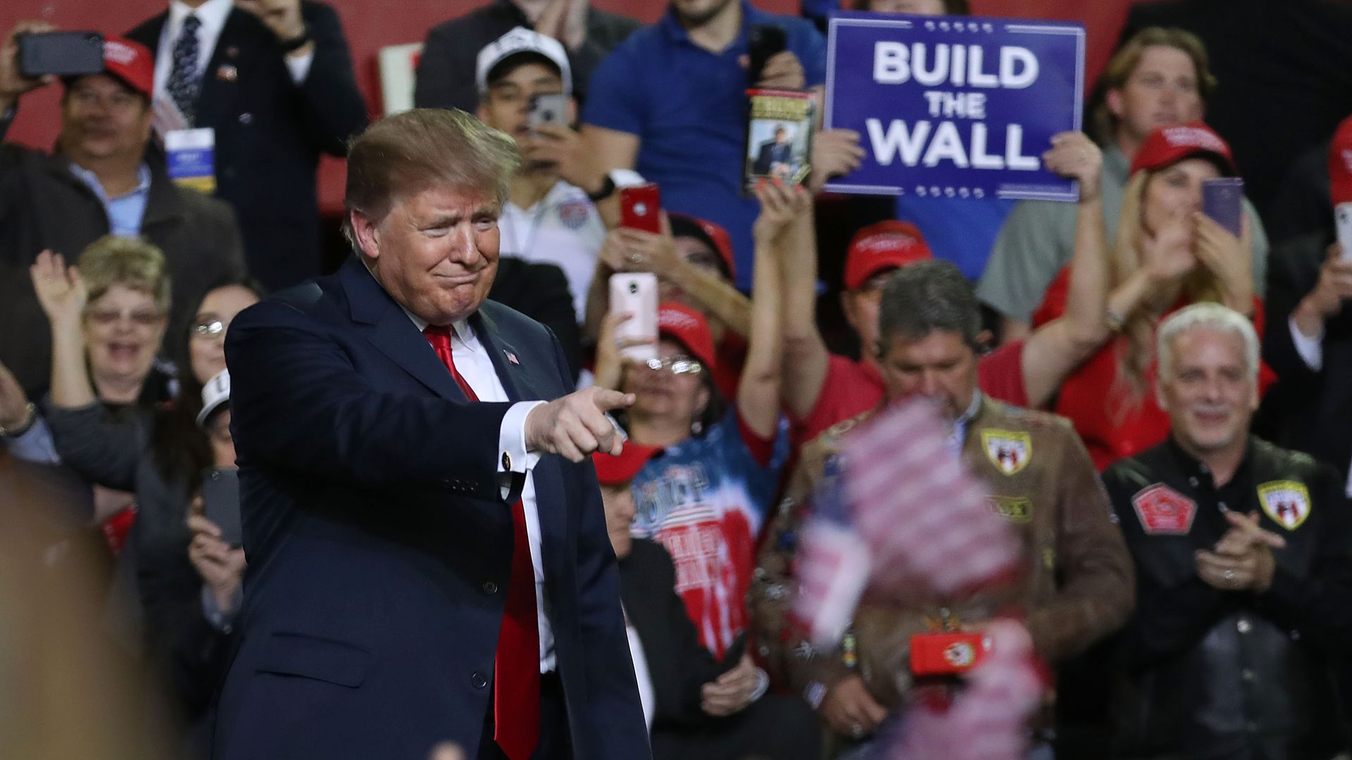 Trump points into a crowd at a rally in Texas.
