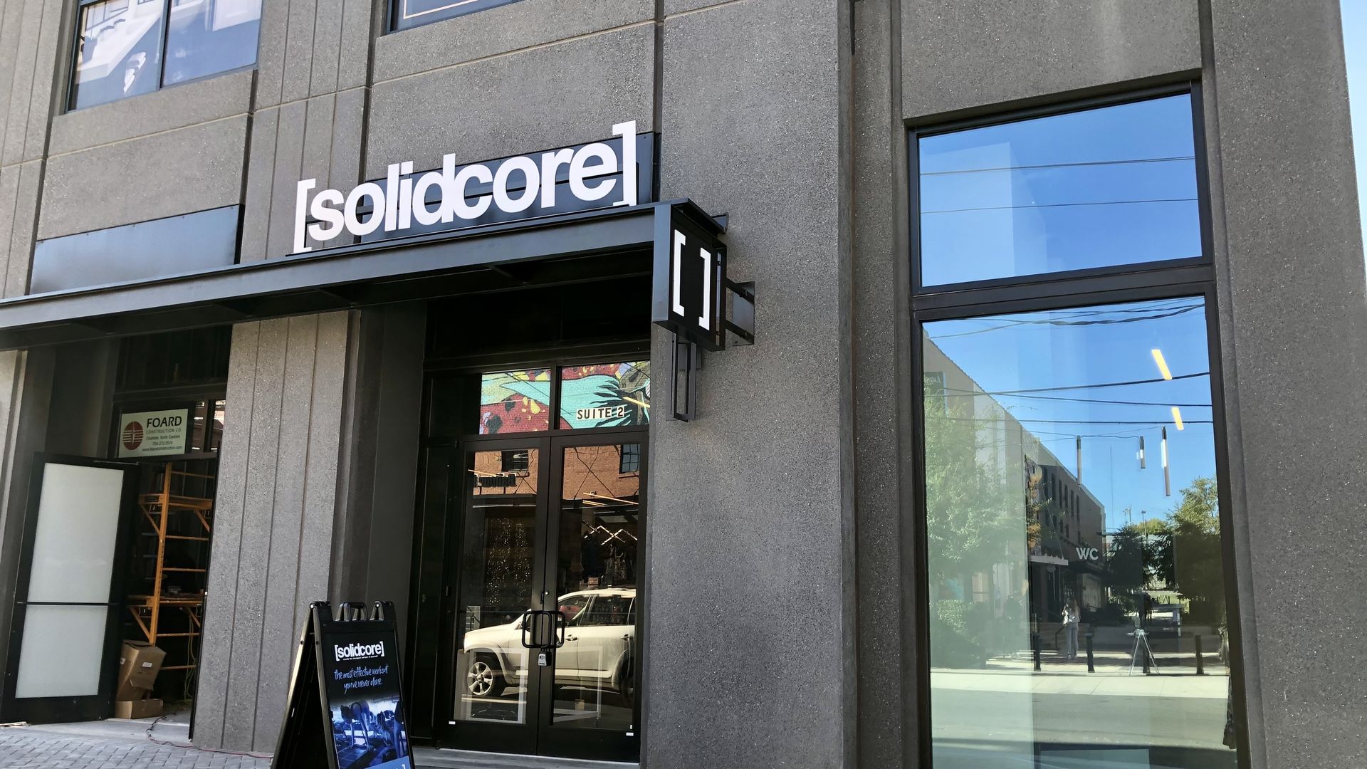 sign that reads solidcore outside of a studio location in charlotte