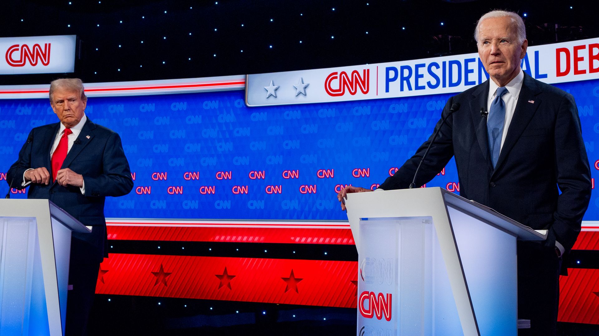 Donald Trump (L) looks at U.S. President Joe Biden during the CNN Presidential Debate at the CNN Studios on June 27, 2024 in Atlanta, Georgia.
