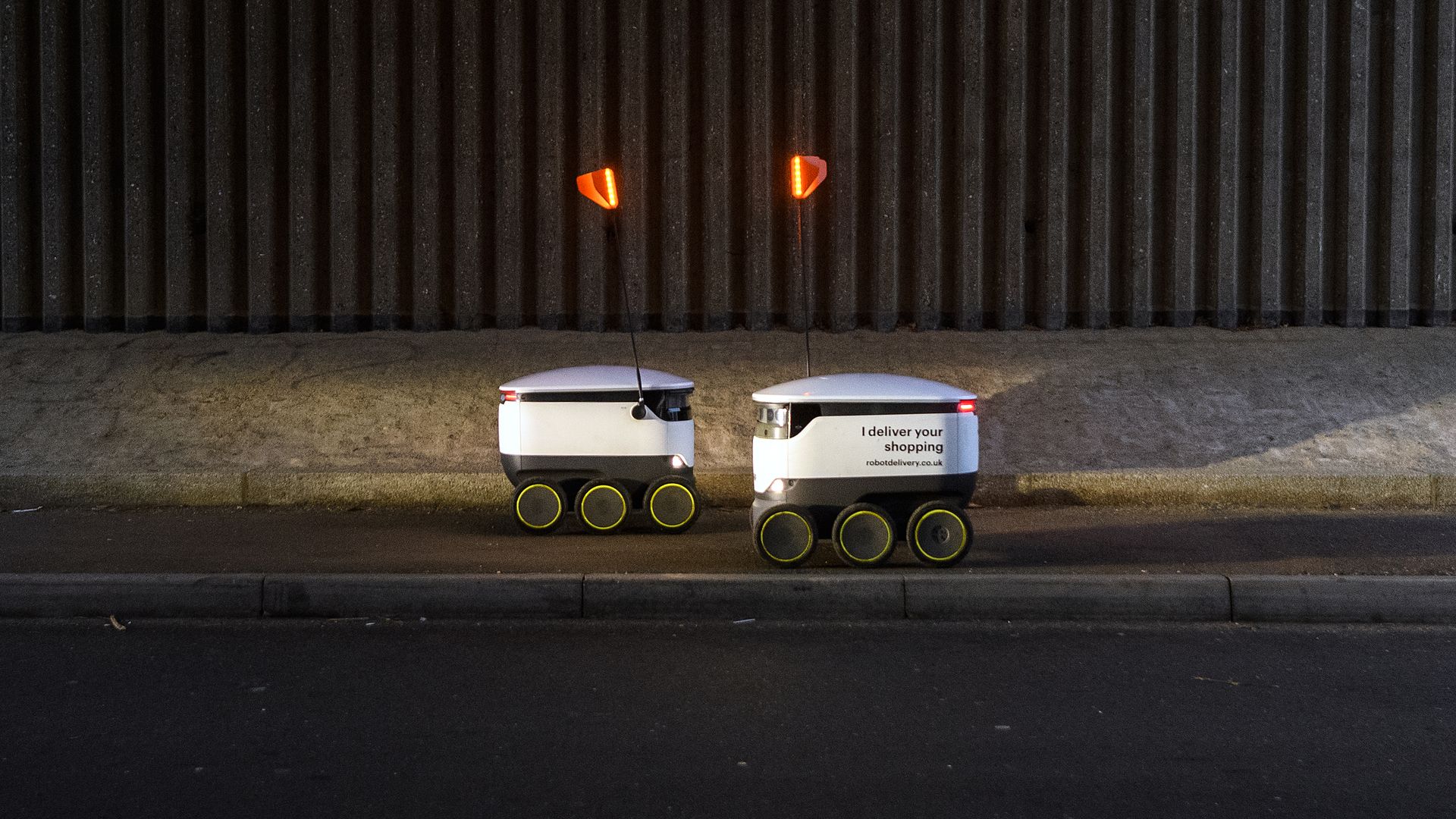 Two delivery robots pass each other