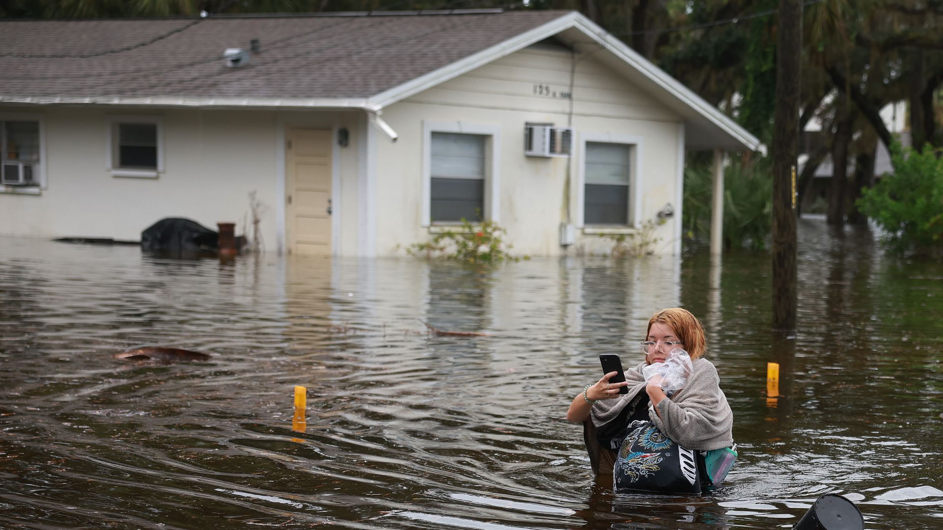  Makatla Ritchter wades through flood waters after having to evacuate her home when the flood waters from Hurricane Idalia inundated it on August 30, 2023 in Tarpon Springs, Florida. Hurricane Idalia is hitting the Big Bend area of Florida. 