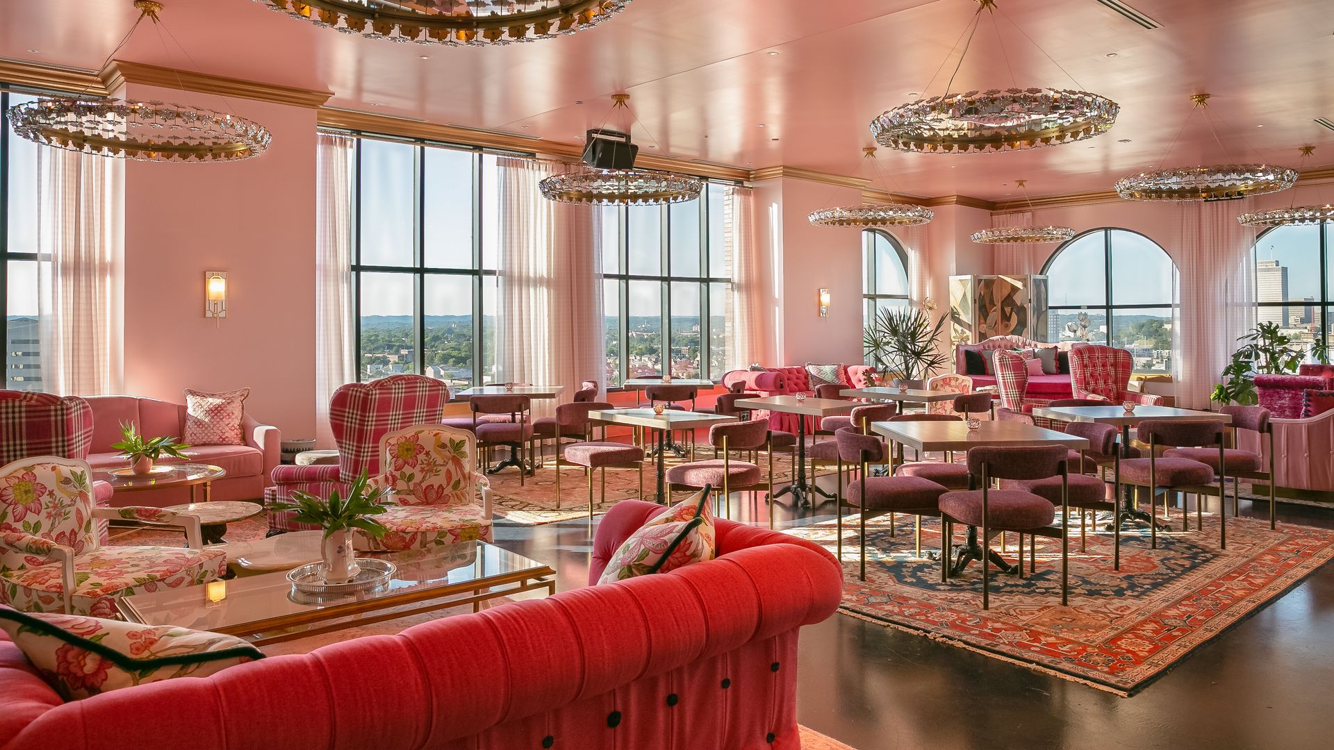A room bathed in pink. Pink walls, sofas and furniture.