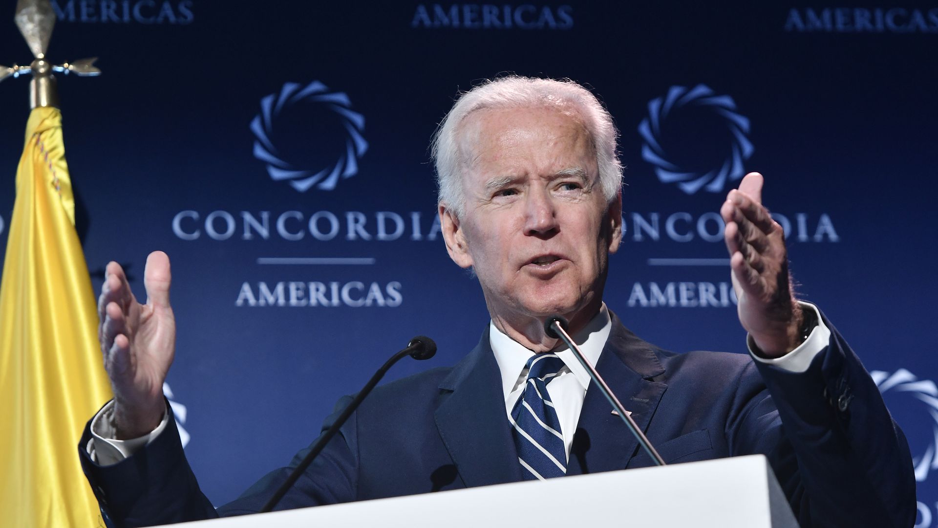 Joe Biden speaking behind a lectern
