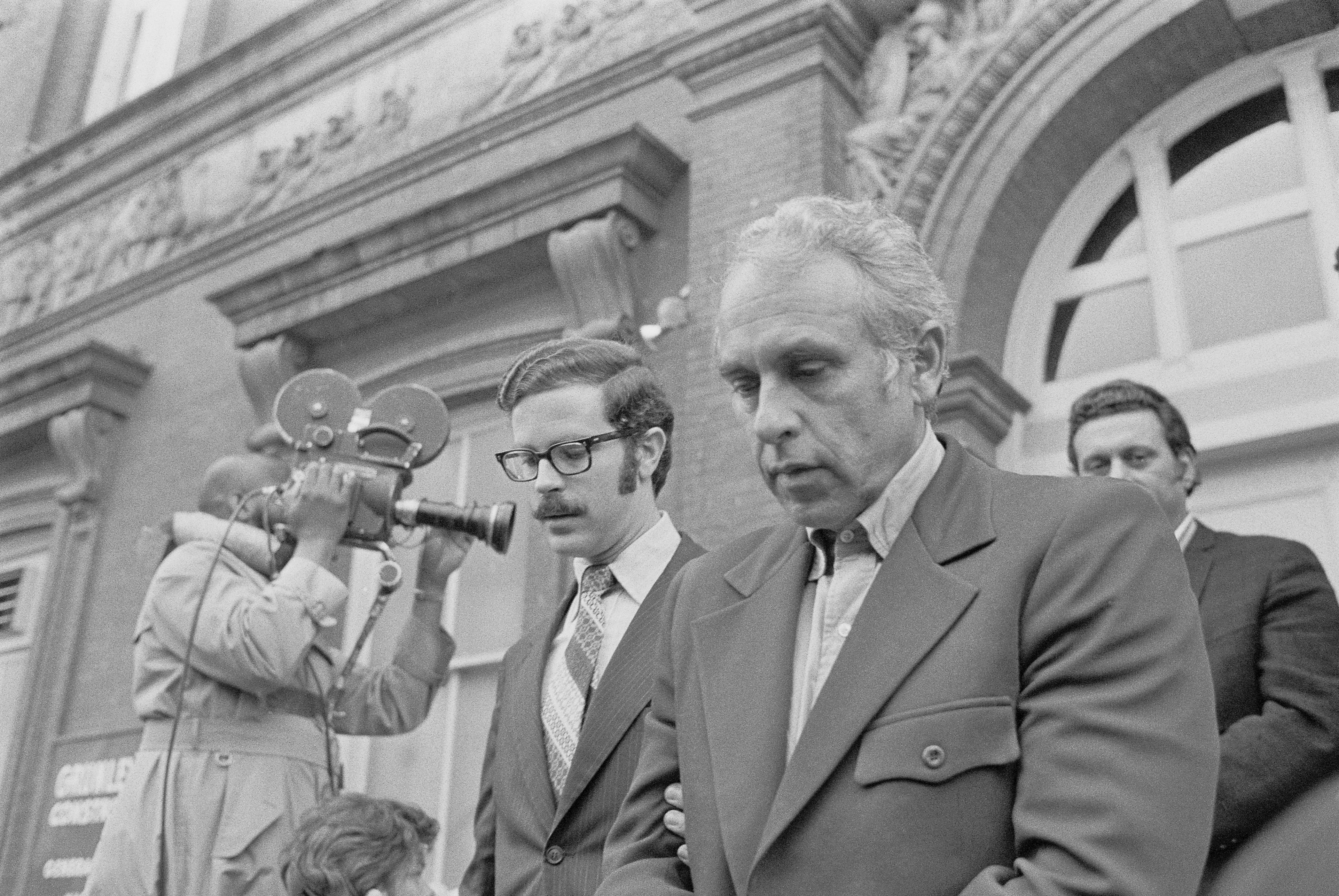 A U.S. marshal escorts Eugenio Martinez from a courthouse after his Watergate arraignment.